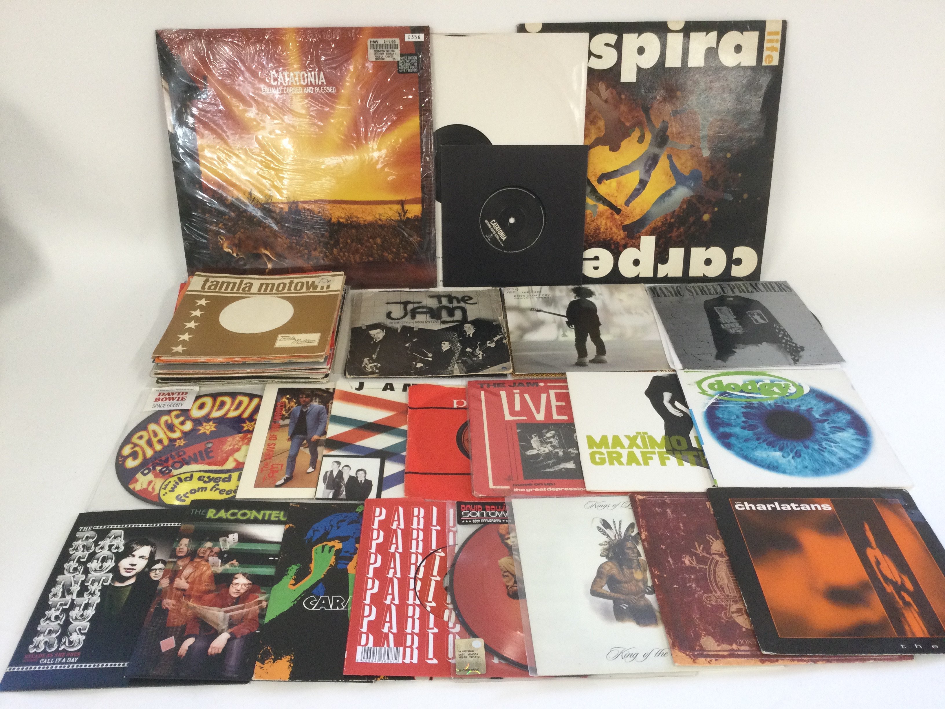 A collection of indie alternative and post punk LPs and 7" singles including picture discs and coloured vinyl plus some spare paper sleeves. Artists include The Jam, David Bowie, The Charlatans, Manic Street Preachers and others.