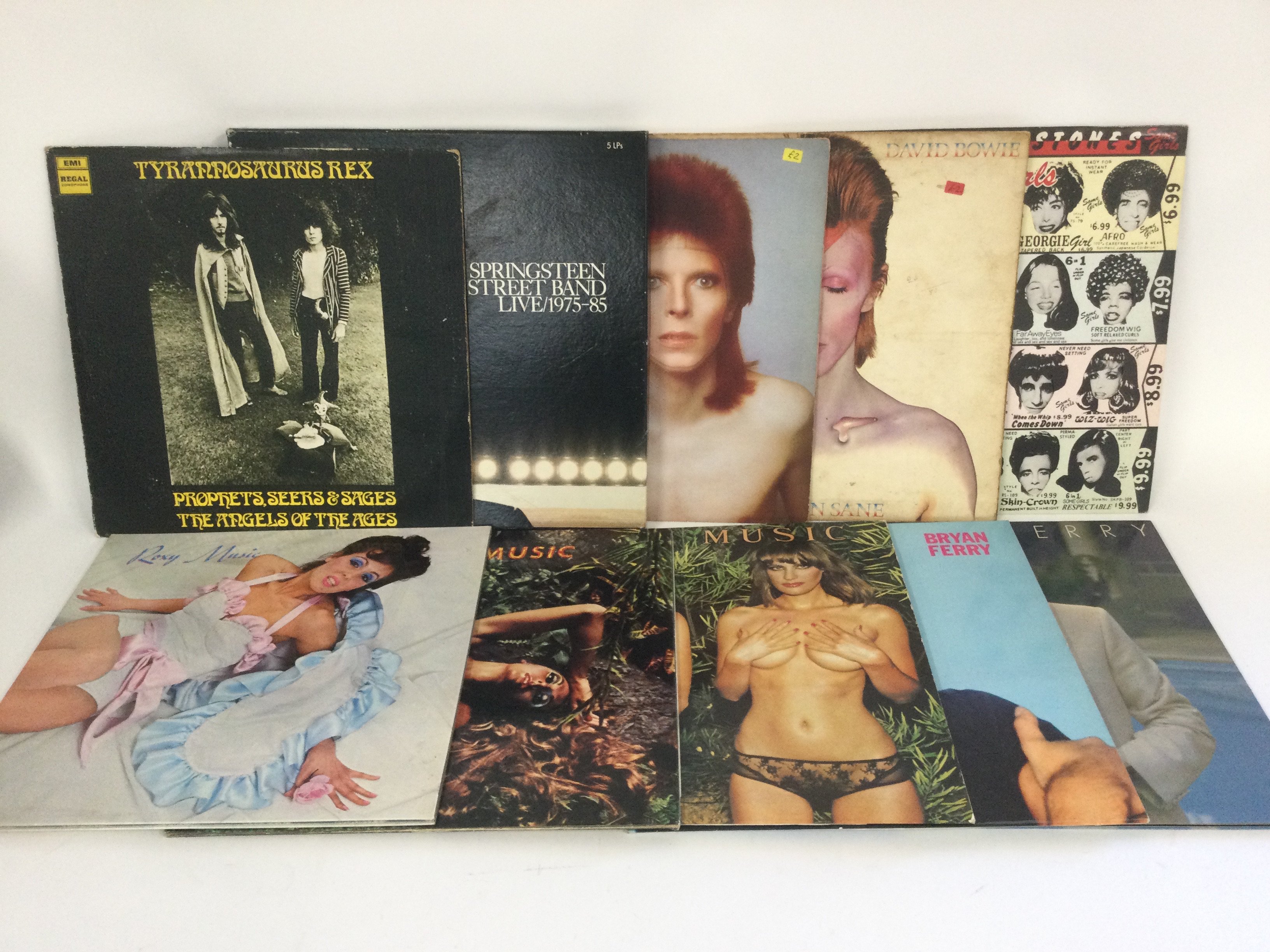 Two bags containing 20 LPs by various artists including David Bowie, Tyrannosaurus Rex, Roxy Music, The Rolling Stones and others.