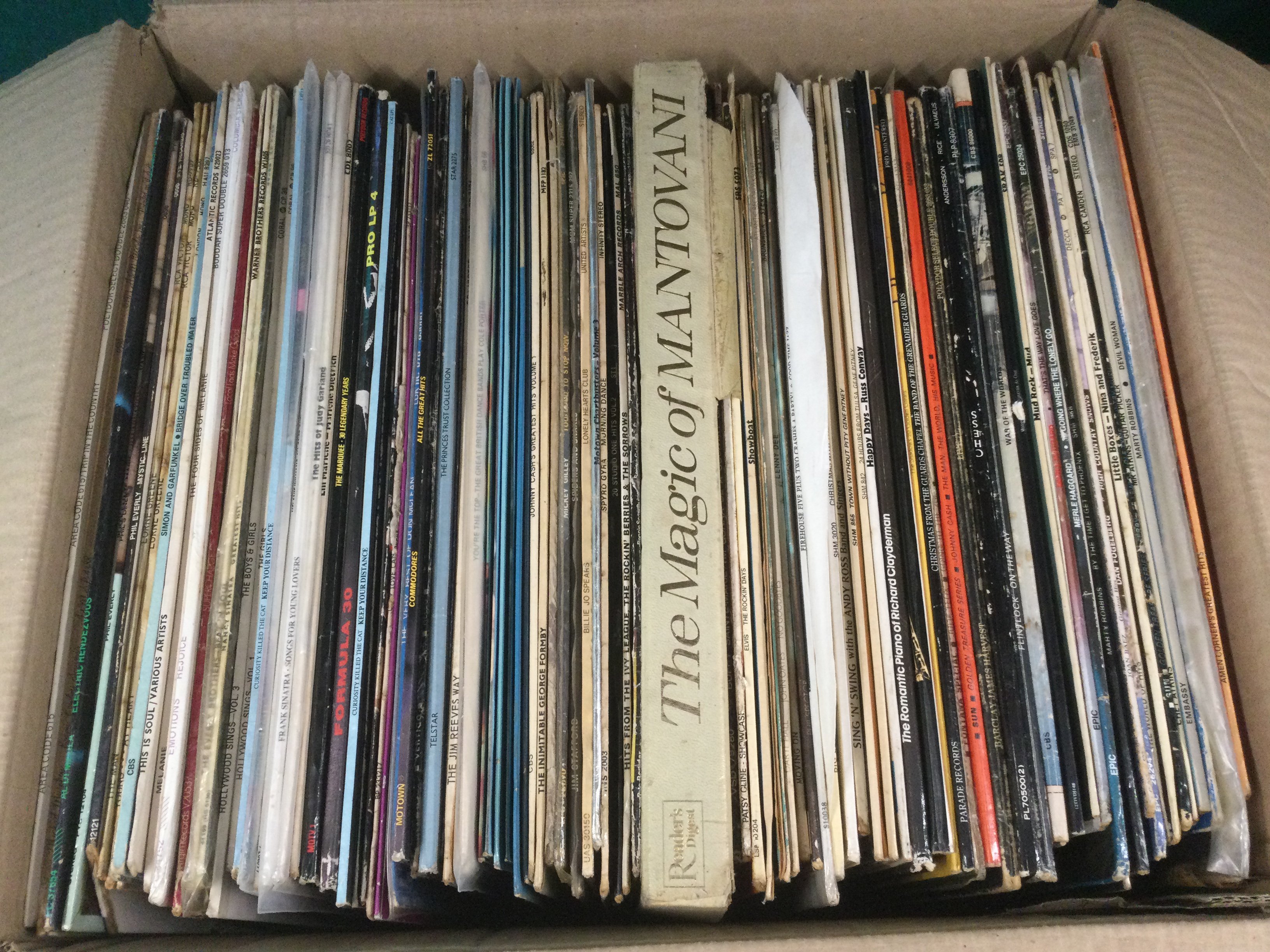 Four boxes of LPs and 12" singles by various artists including James Brown, Little Richard, Abba and many more.