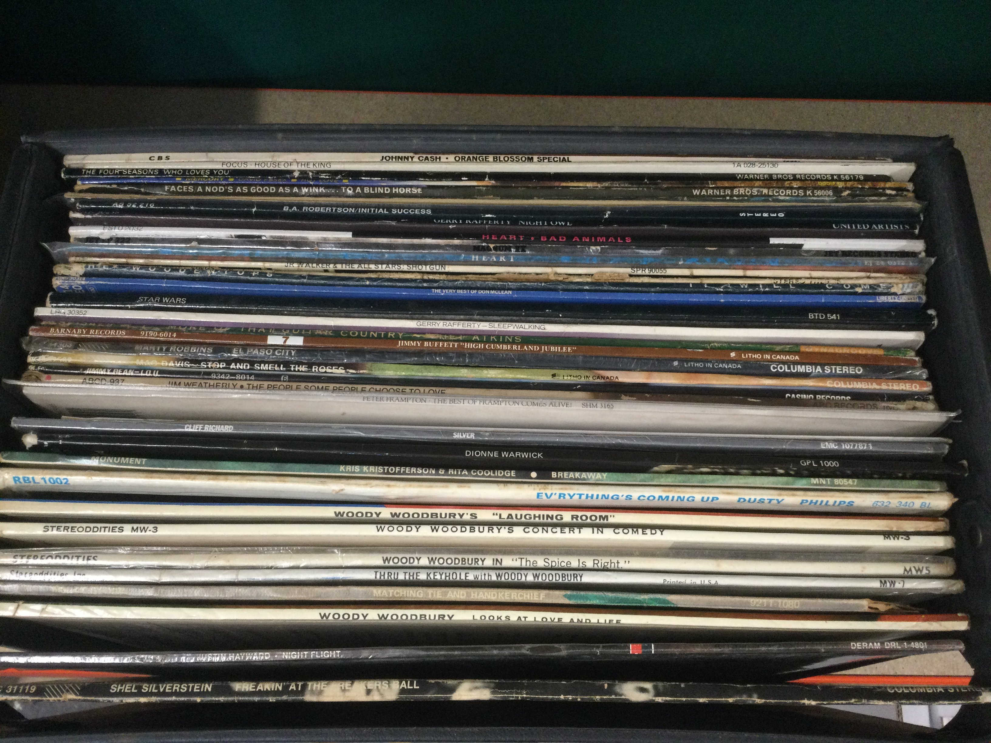 Eight record cases of LPs by various artists including The Small Faces, Bruce Springsteen, Elvis Presley and others.