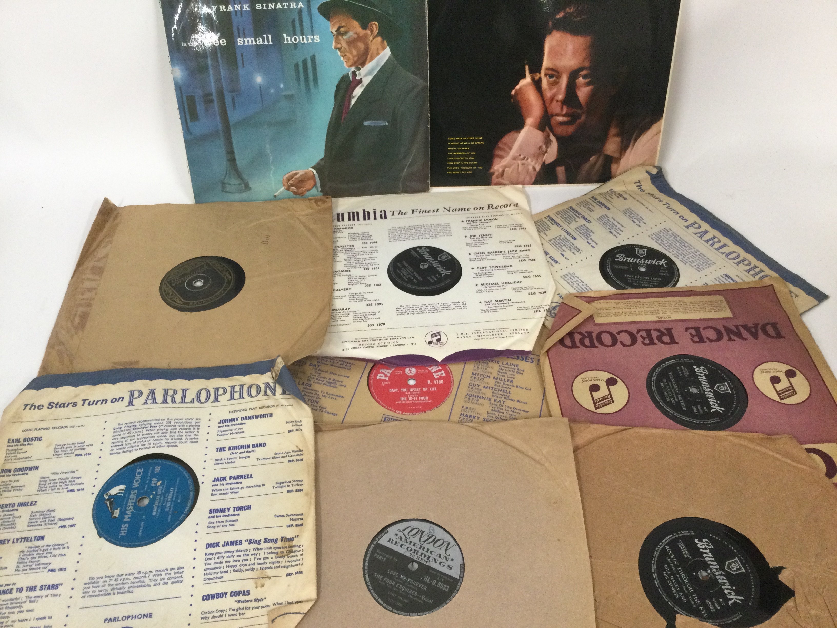 A collection of Elvis Presley LPs plus a record case and a box of 78s by various artists including Elvis Presley, Bill Haley, Frank Sinatra and others.