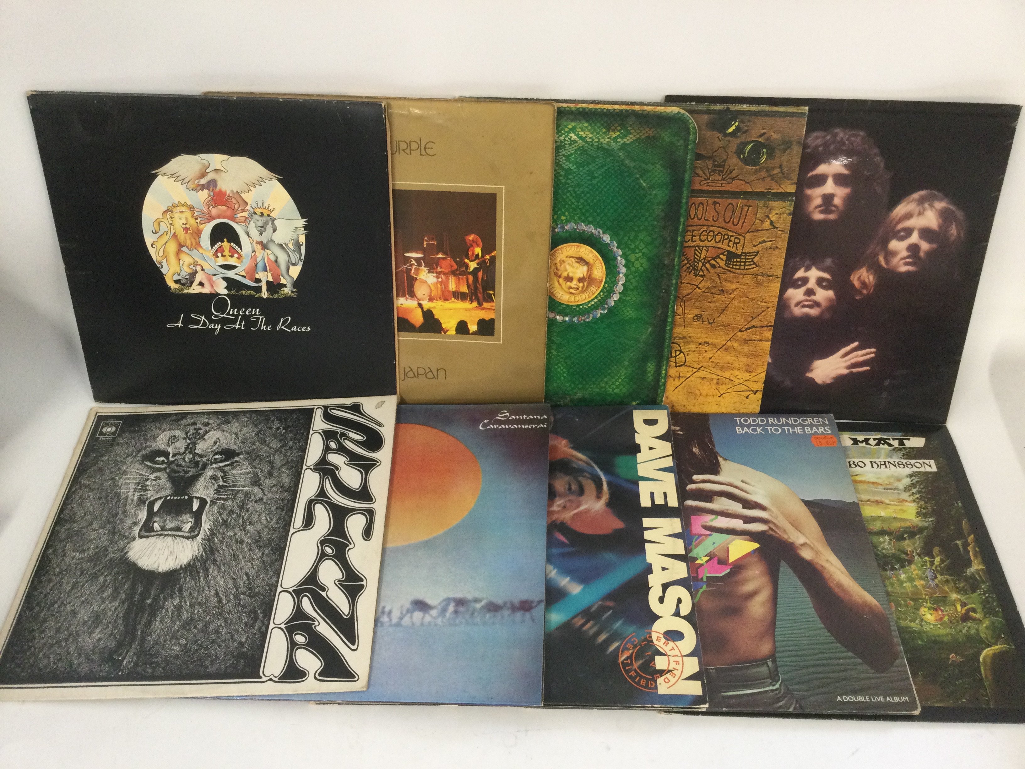 Two bags containing 20 rock LPs by various LPs including Deep Purple, Queen, Rainbow, Free and others.