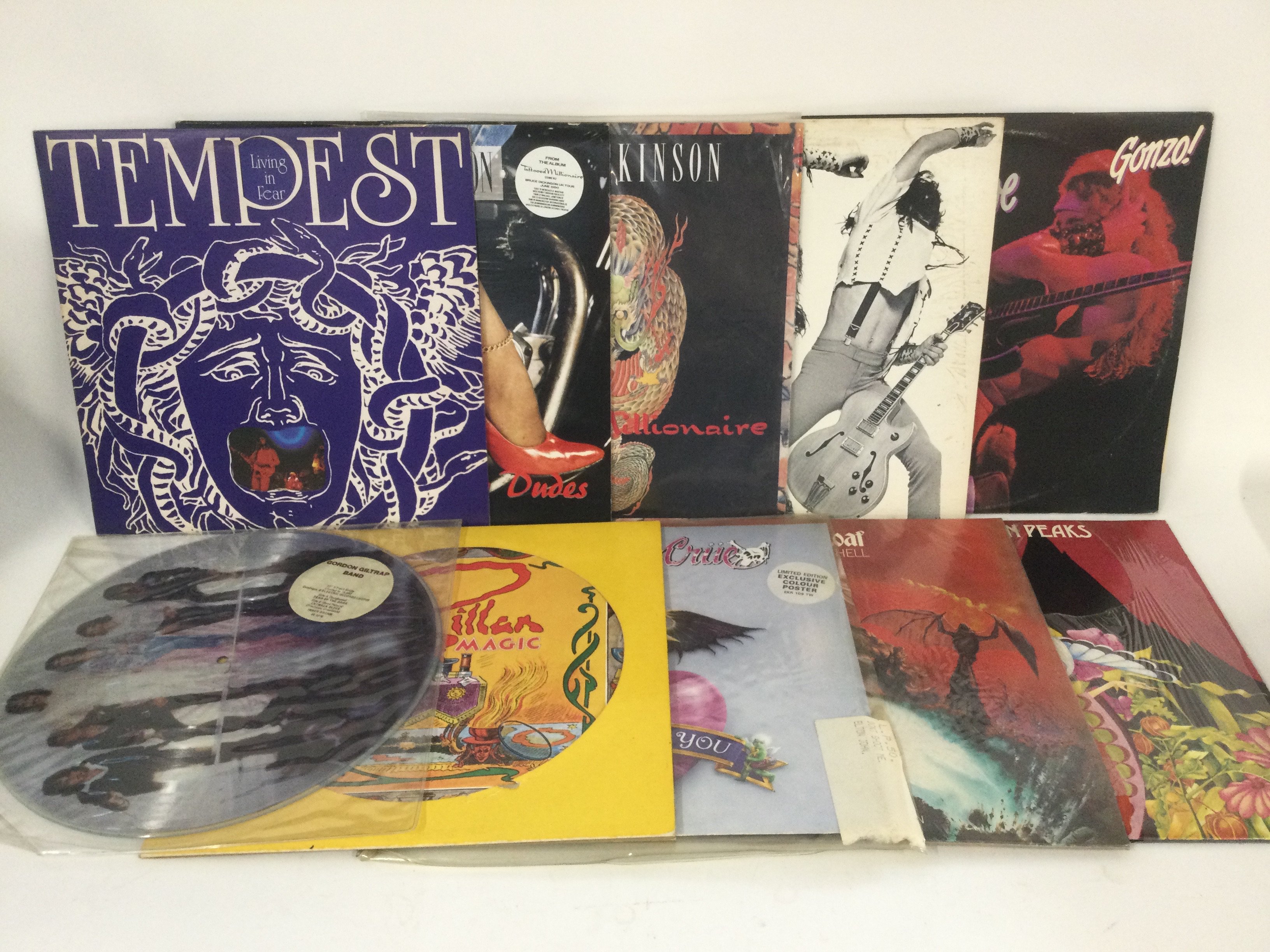 Two bags containing 20 rock LPs and 12" singles by various artists including Bad Company, Meat Loaf, Motley Crue and others