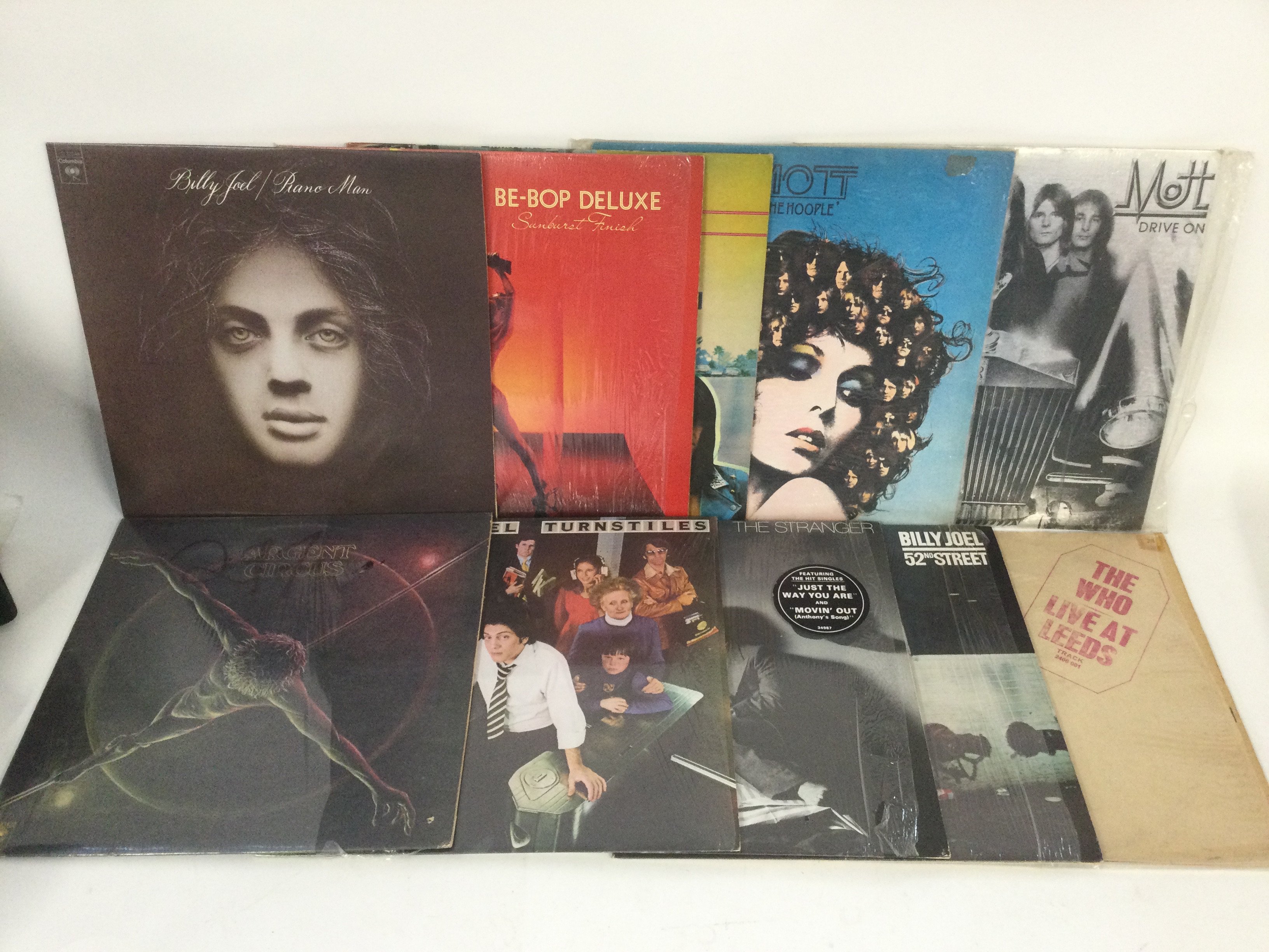 Two bags containing 20 rock and pop LPs by various artists including The Who, Mott The Hoople, Billy Joel and others.