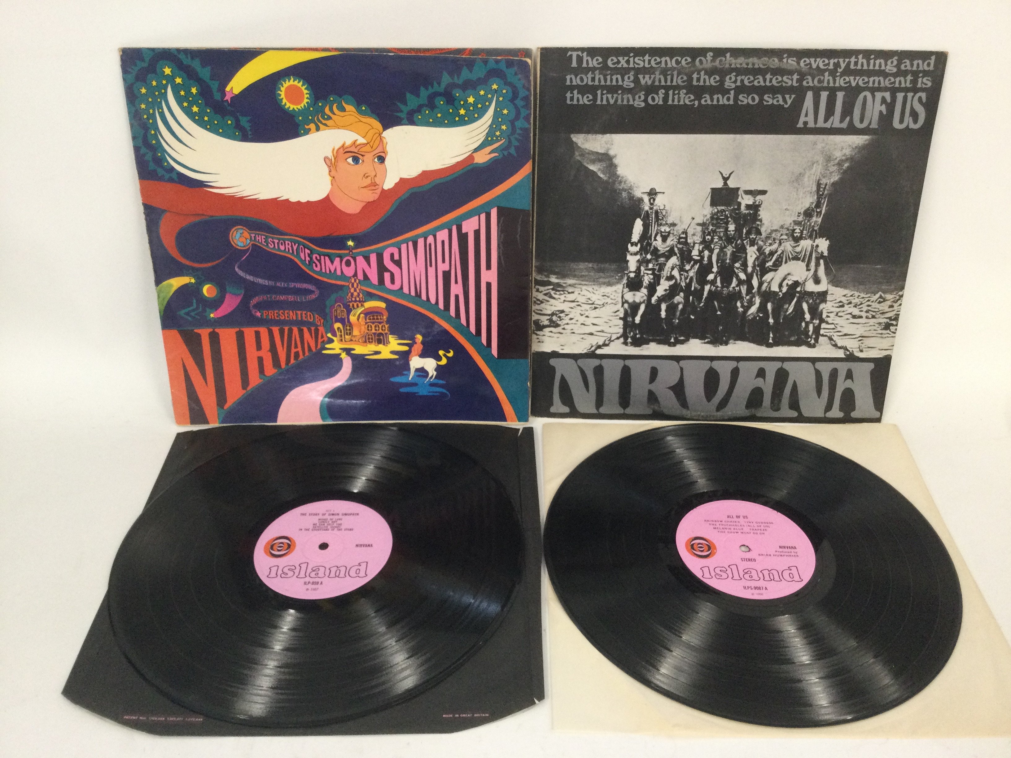 Two early UK pressings of Nirvana (UK) LPs comprising 'All If Us' and 'The Story Of Simon Simopath'. Vinyl Ex.