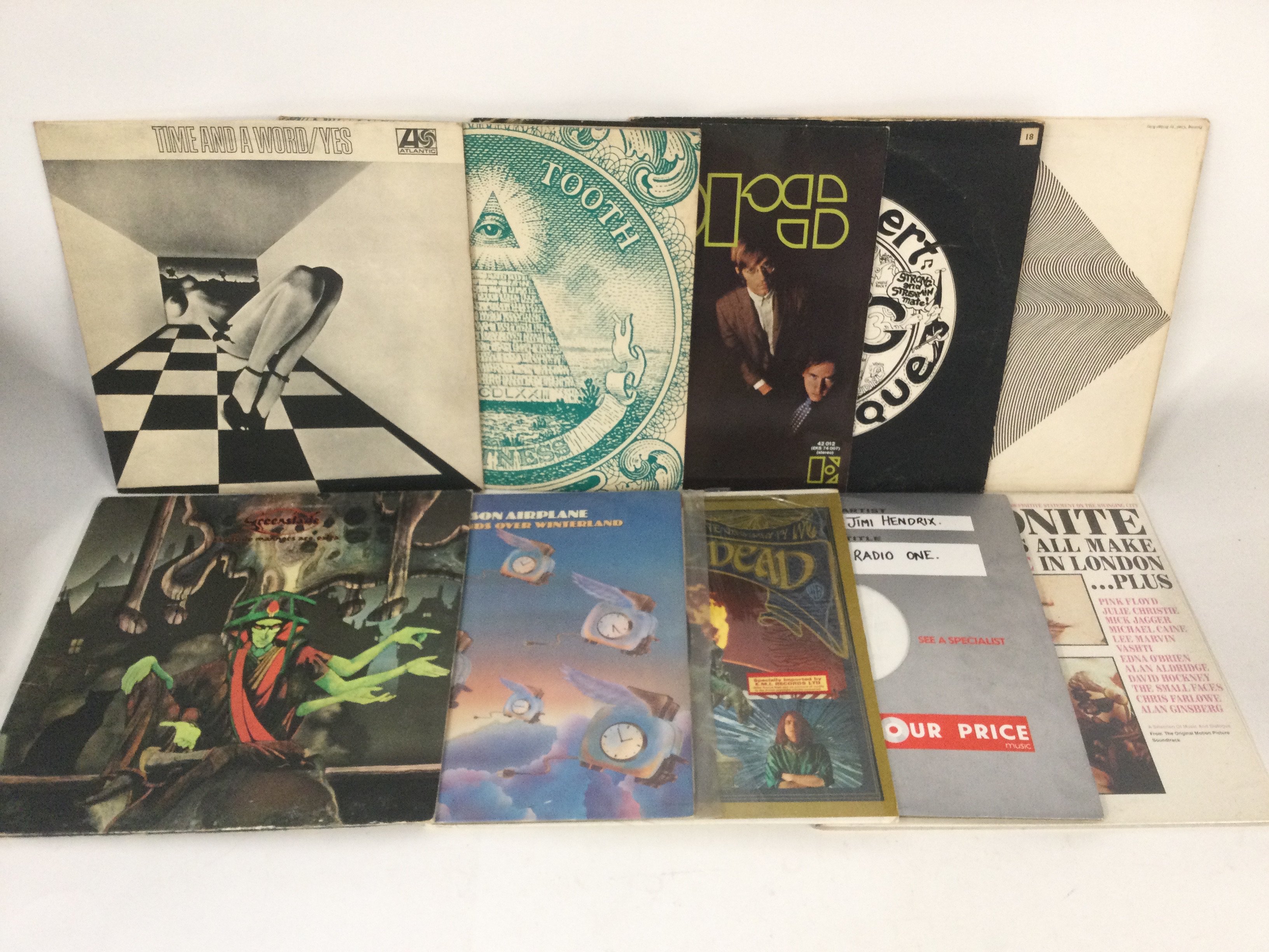 Two bags containing 20 psychedelic rock and ambient LPs by various artists including The Doors, The Grateful Dead, Gong, Spooky Tooth and others.