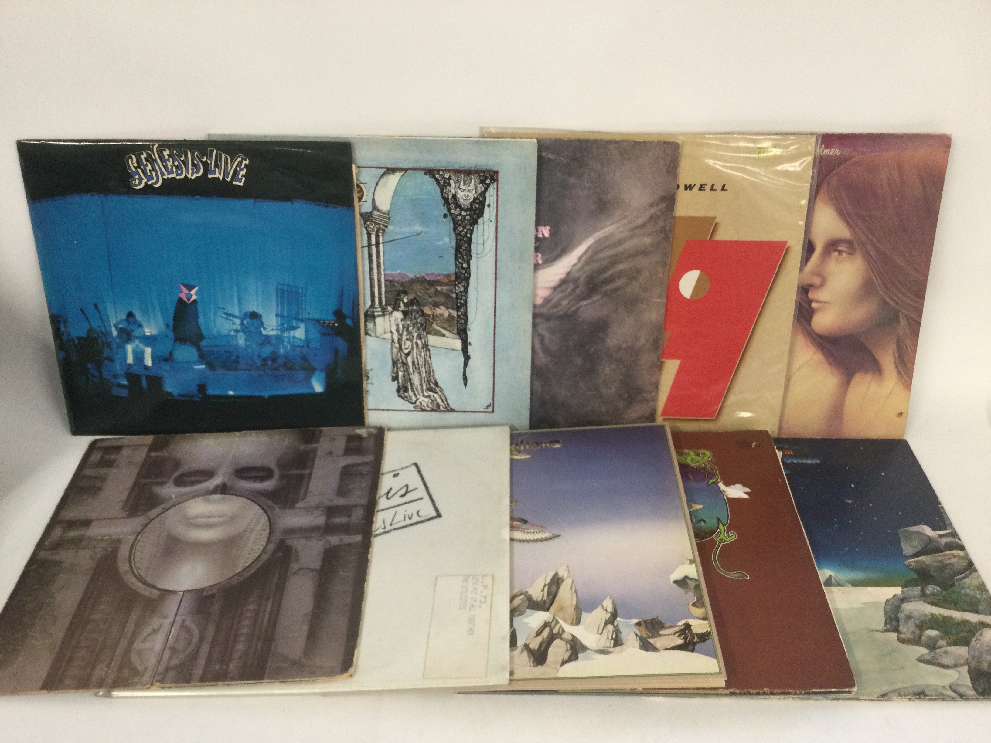 Two bags containing 20 prog rock LPs by various artists including Genesis, ELP, Yes and solo releases.