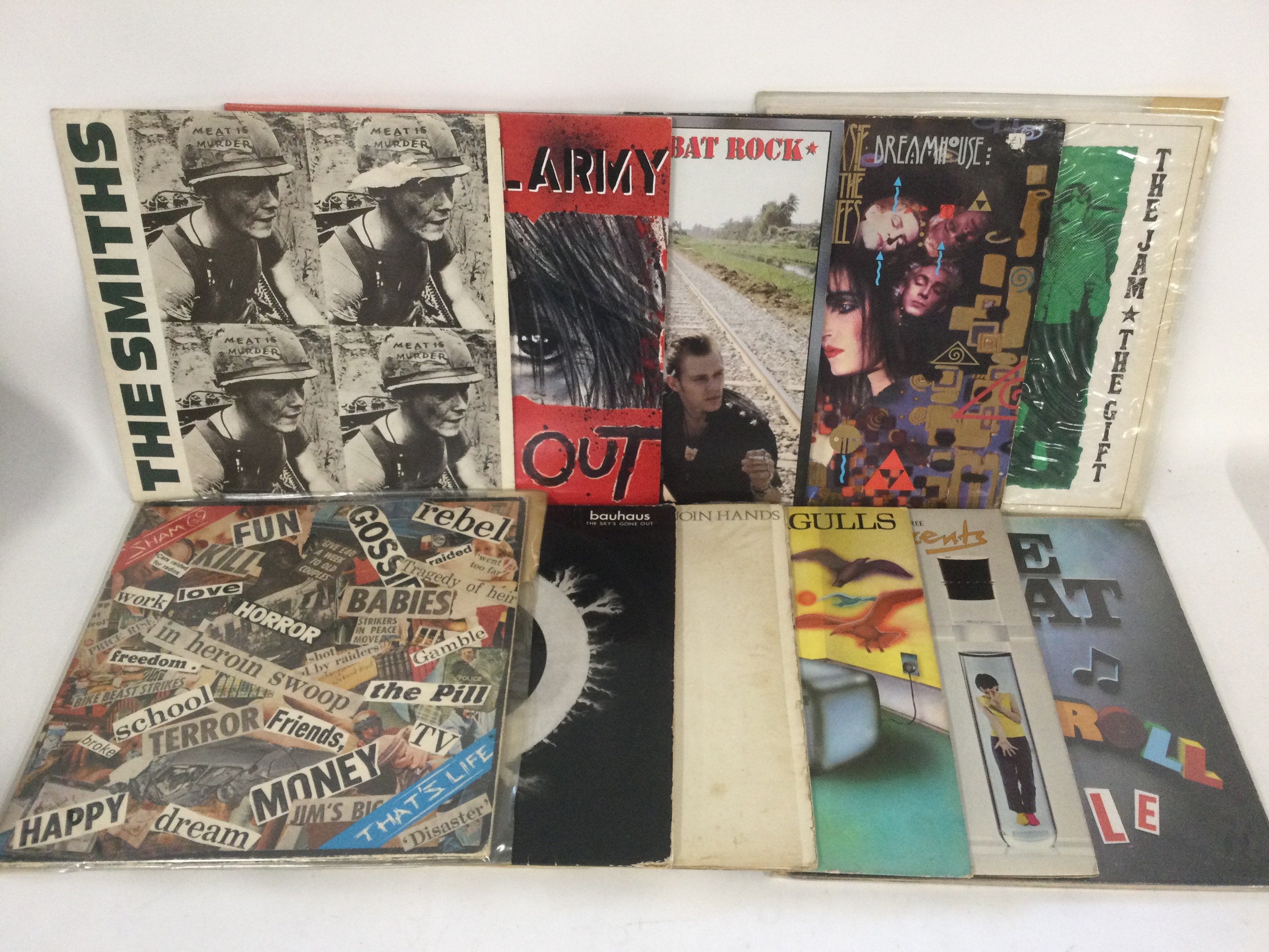 Two bags containing 22 punk and post punk LPs and 12" singles by various artists including Sex Pistols, Siouxsie & The Banshees, The Smiths and others.