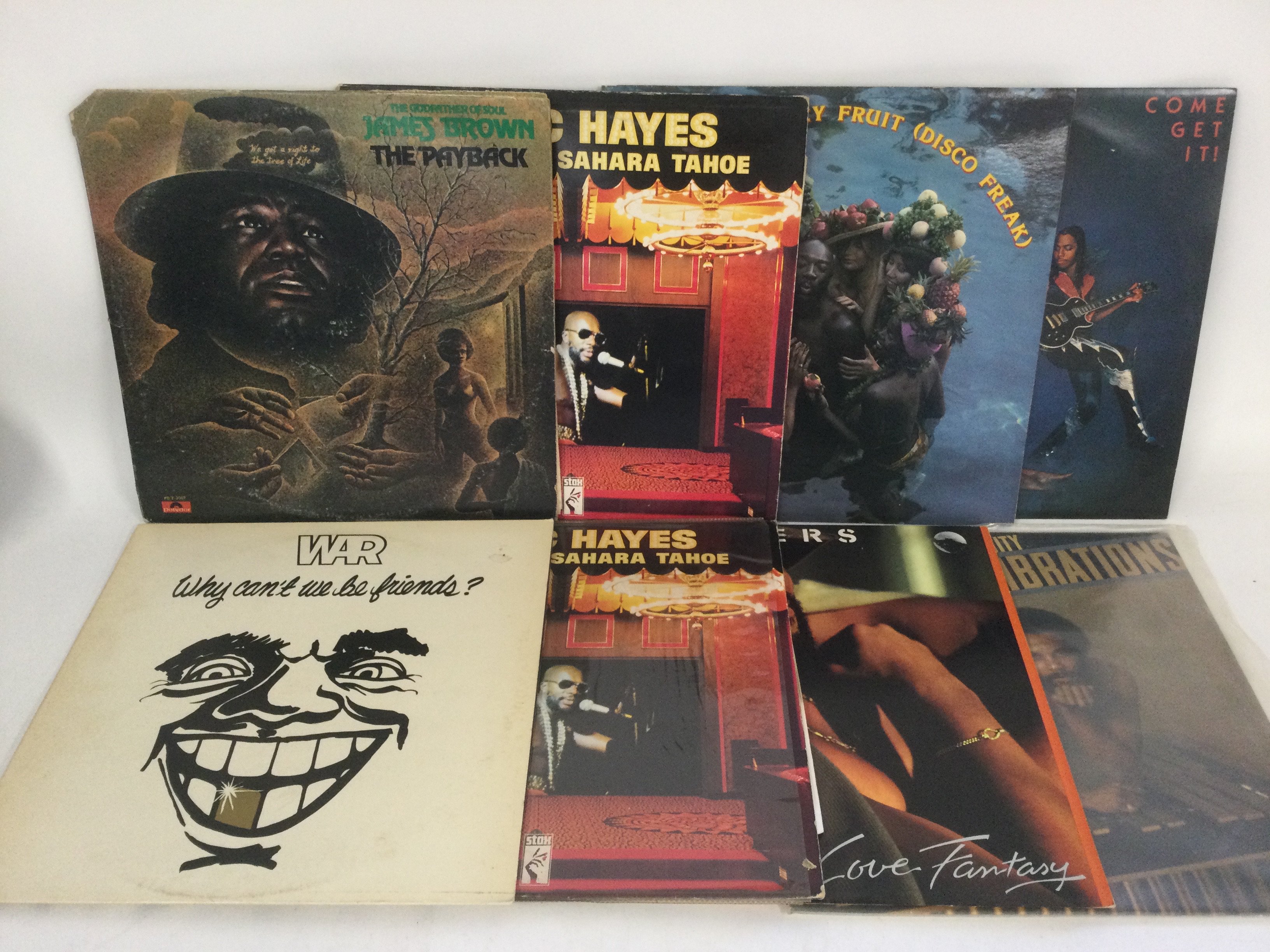 Two bags containing 25 funk and soul LPs and 12" singles by various artists including Isaac Hayes, James Brown, Roy Ayers and others.