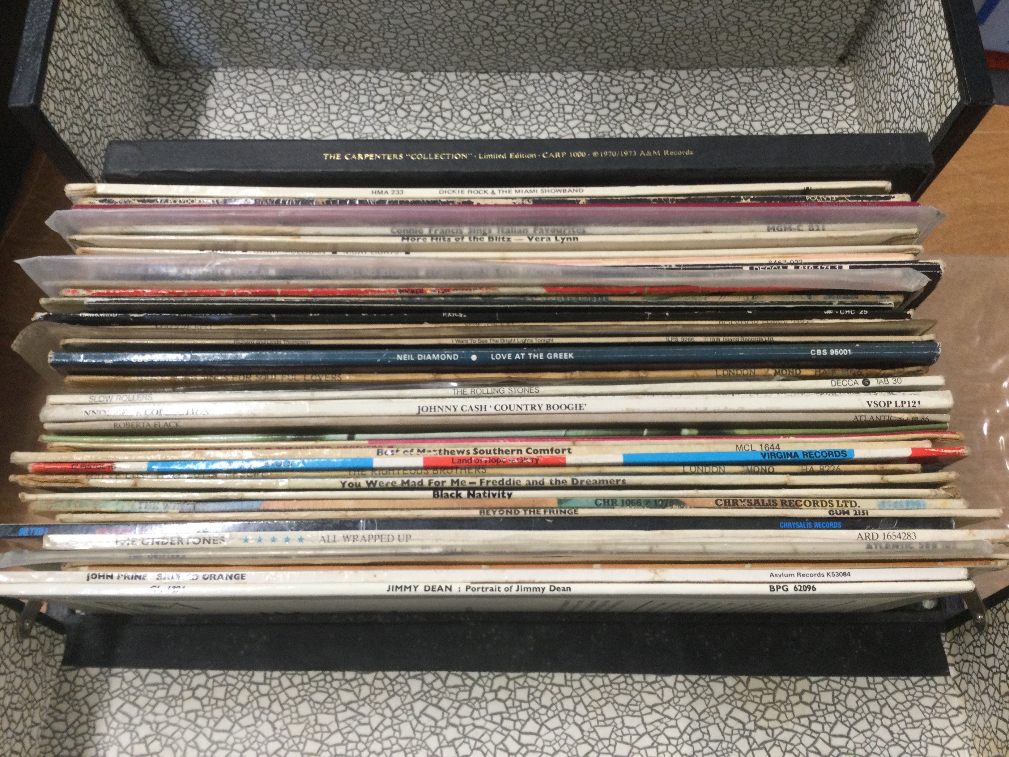 Eight record cases of LPs and 12" singles by various artists including The Rolling Stones, Eric Clapton, Elton John and many more