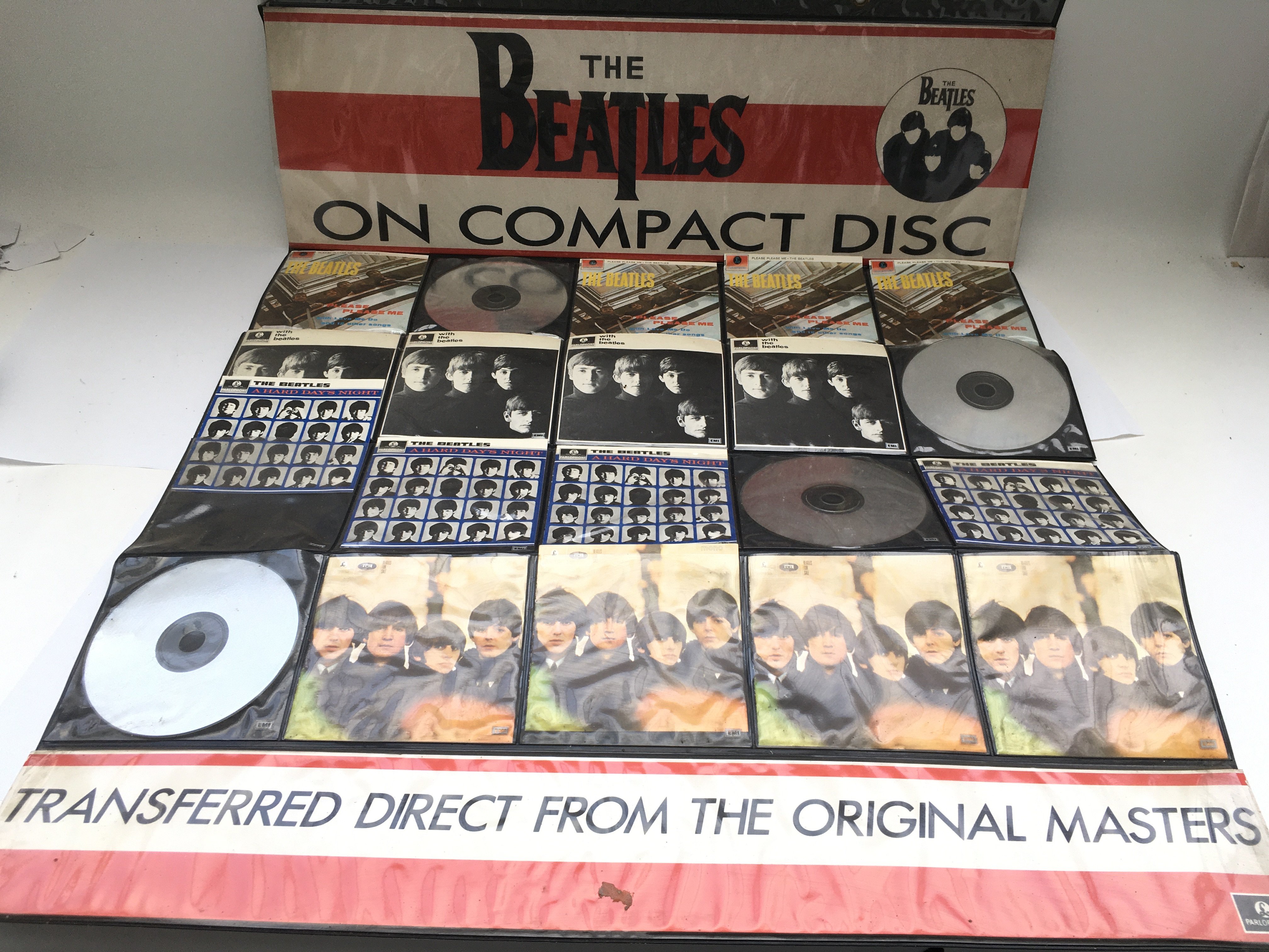 Three Beatles retail displays for CDs plus a Beatles CD bread bin (incomplete) and other CD sets.