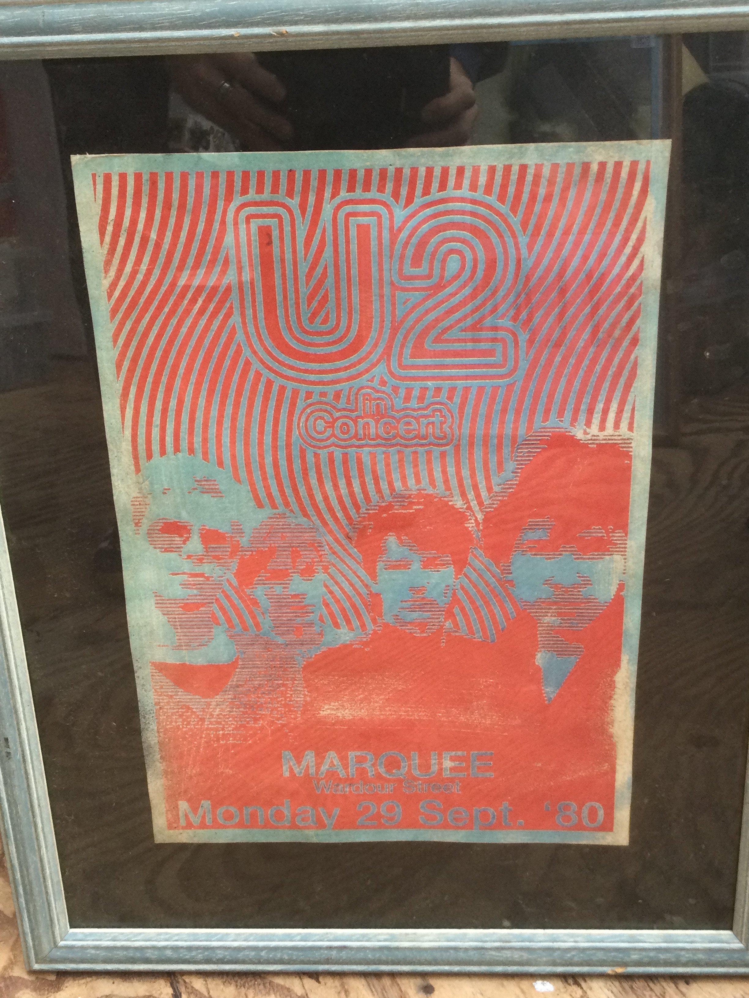 A framed and glazed U2 concert poster for The Marquee September 1980, approx 27cm x 39cm excluding frame.