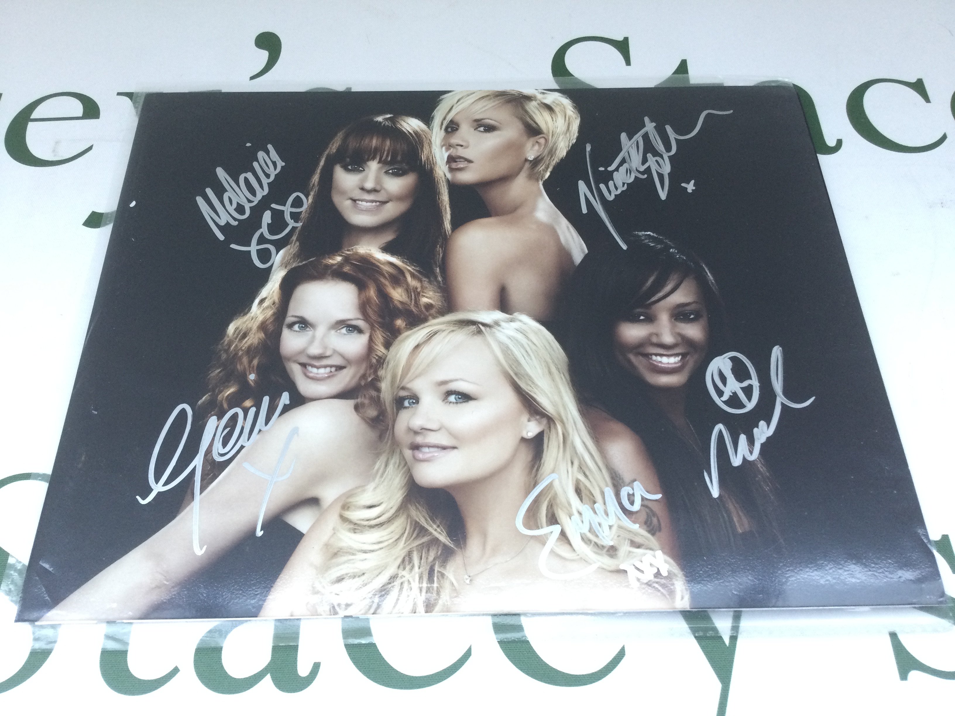 A fully signed Spice Girls publicity photo, approx 25cm x 20cm.