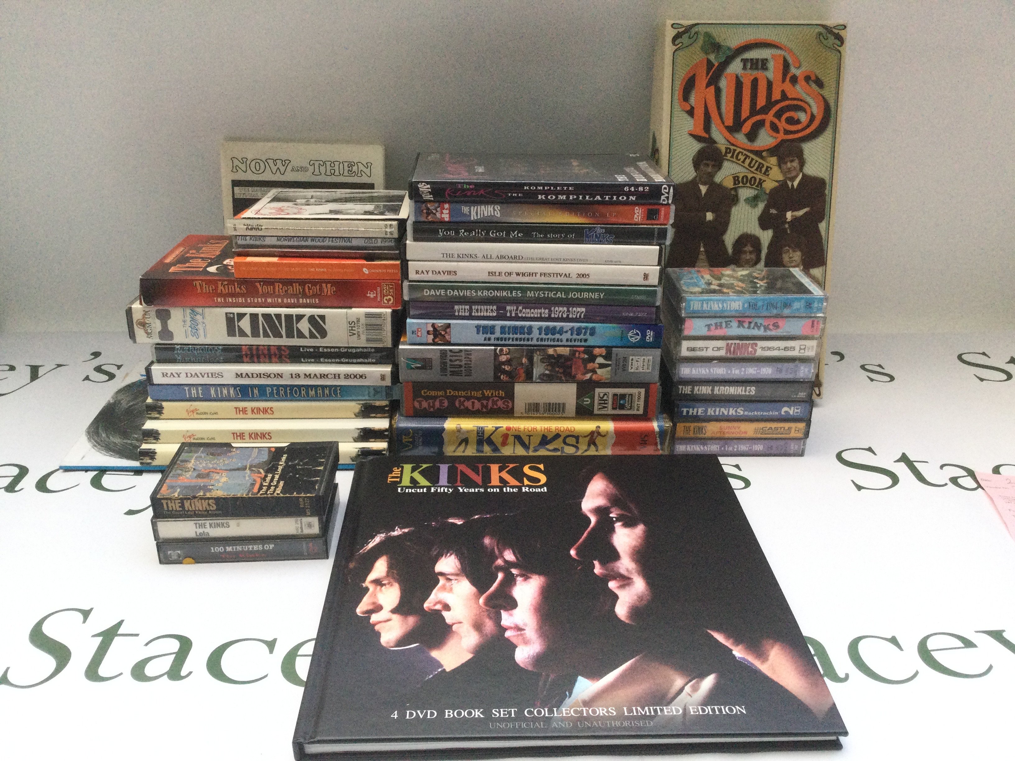 A collection of Kinks CD box sets, DVDs, VHS tapes and audio cassettes.