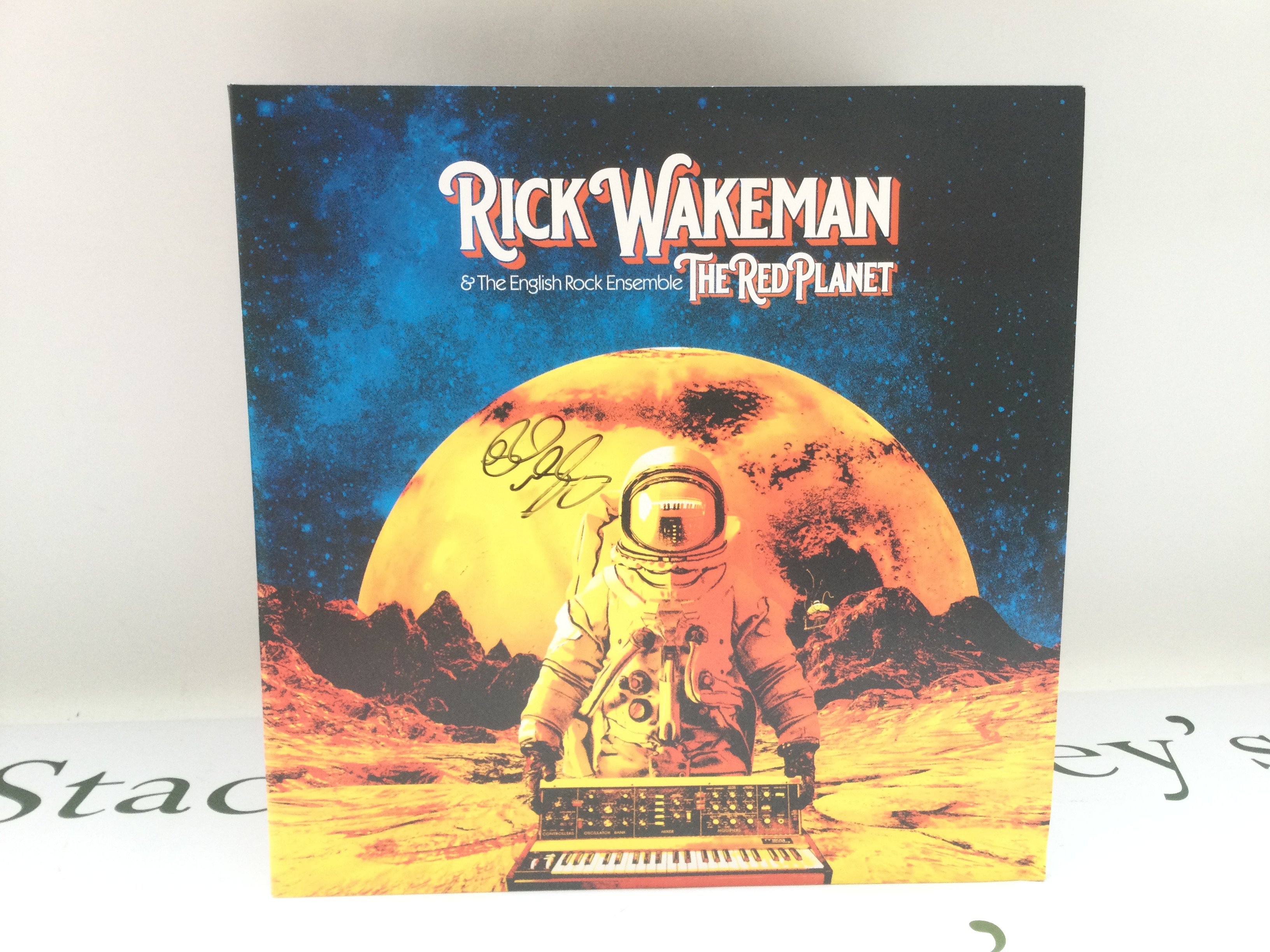 A signed limited edition Rick Wakeman & The English Rock Ensemble 'The Red Planet' red vinyl double LP.