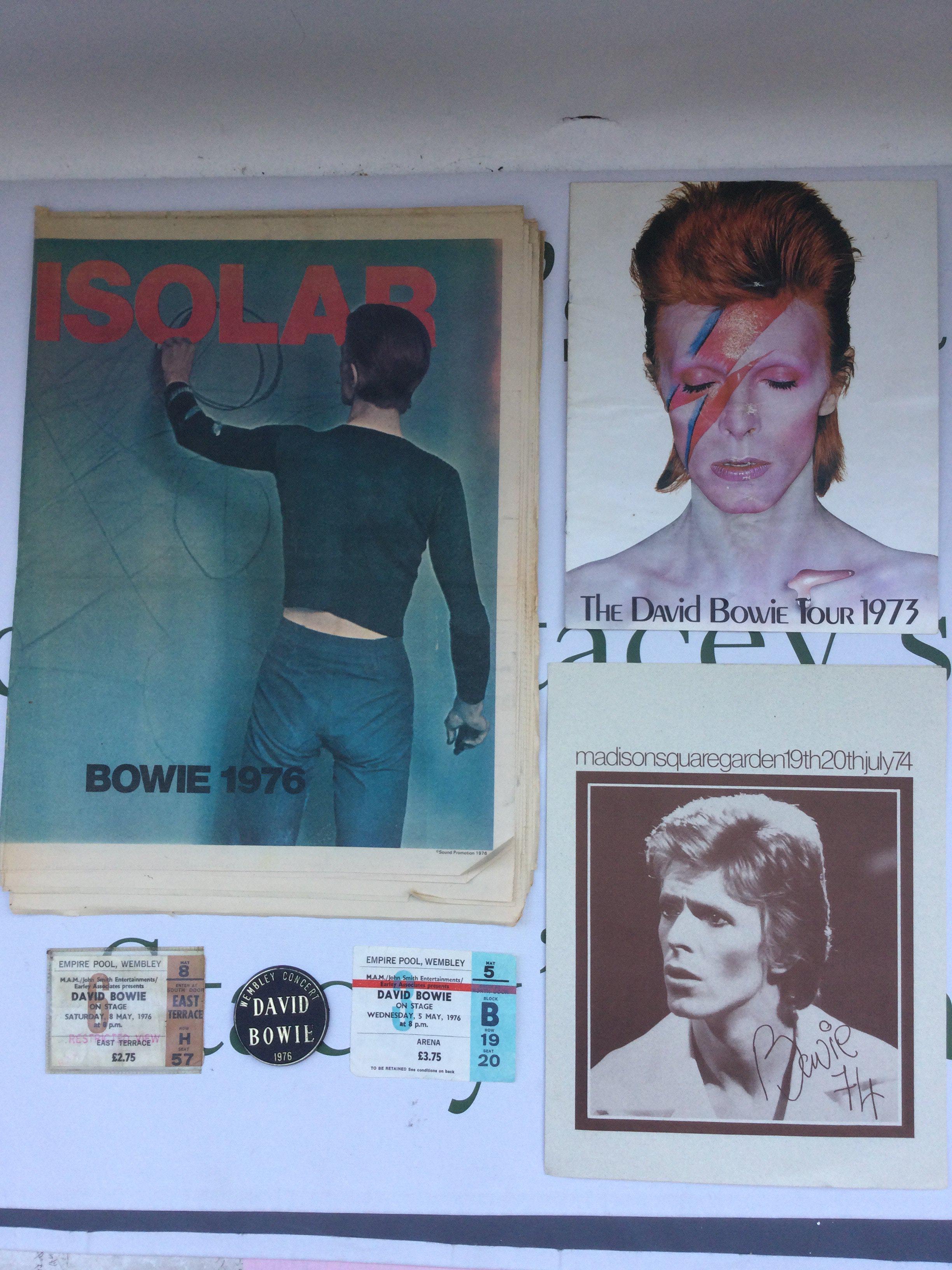A collection of David Bowie tour ephemera comprising two tickets for performances at The Empire Pool, Wembley 1976 and original tour programme plus two other tour programmes from 1973 and 1974 plus a 1976 Wembley concert badge and other items.