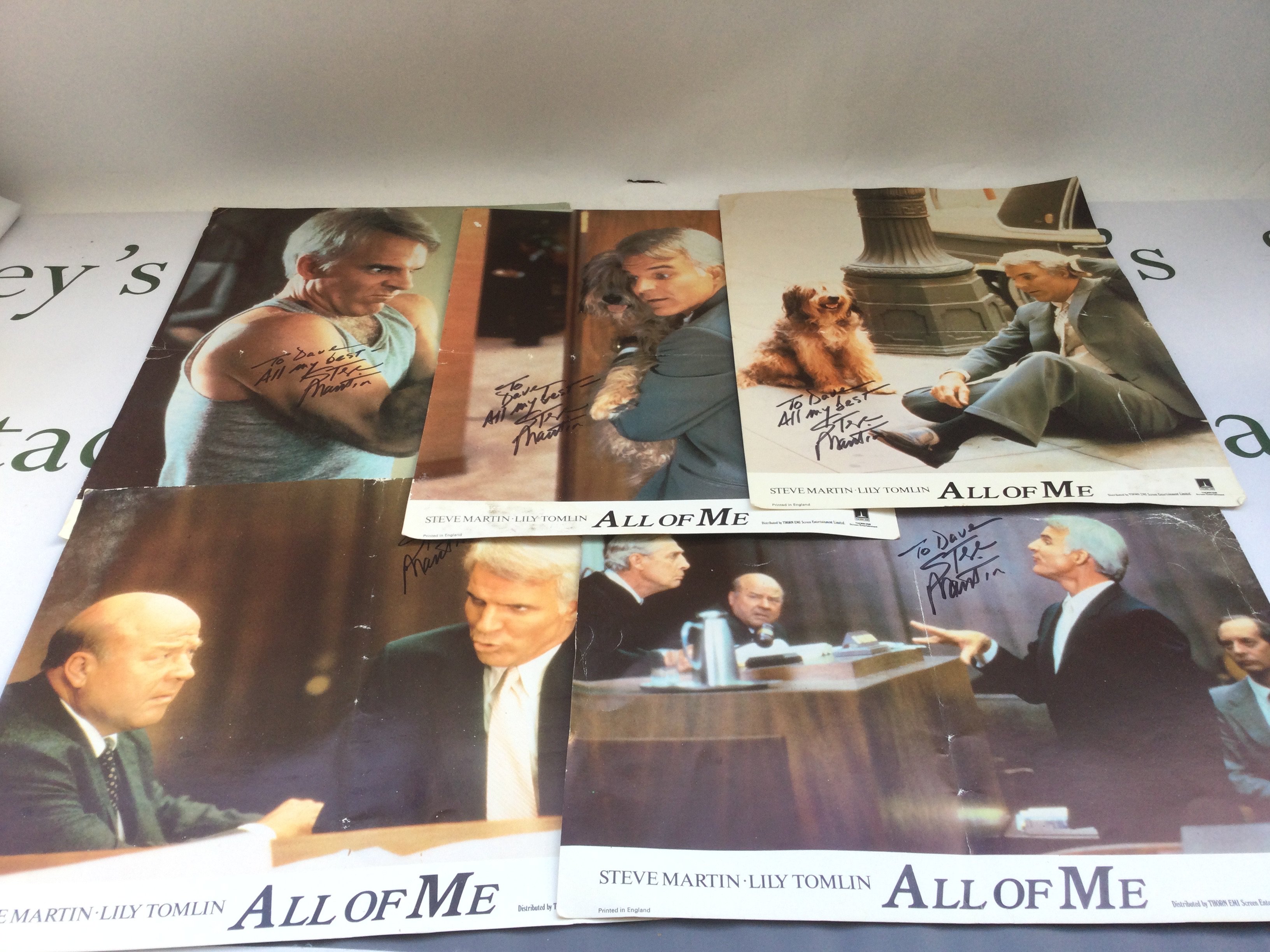 A collection of film related memorabilia comprising some Steve Martin signed lobby cards for 'All Of Me', movie press packs, Star Trek poster etc.