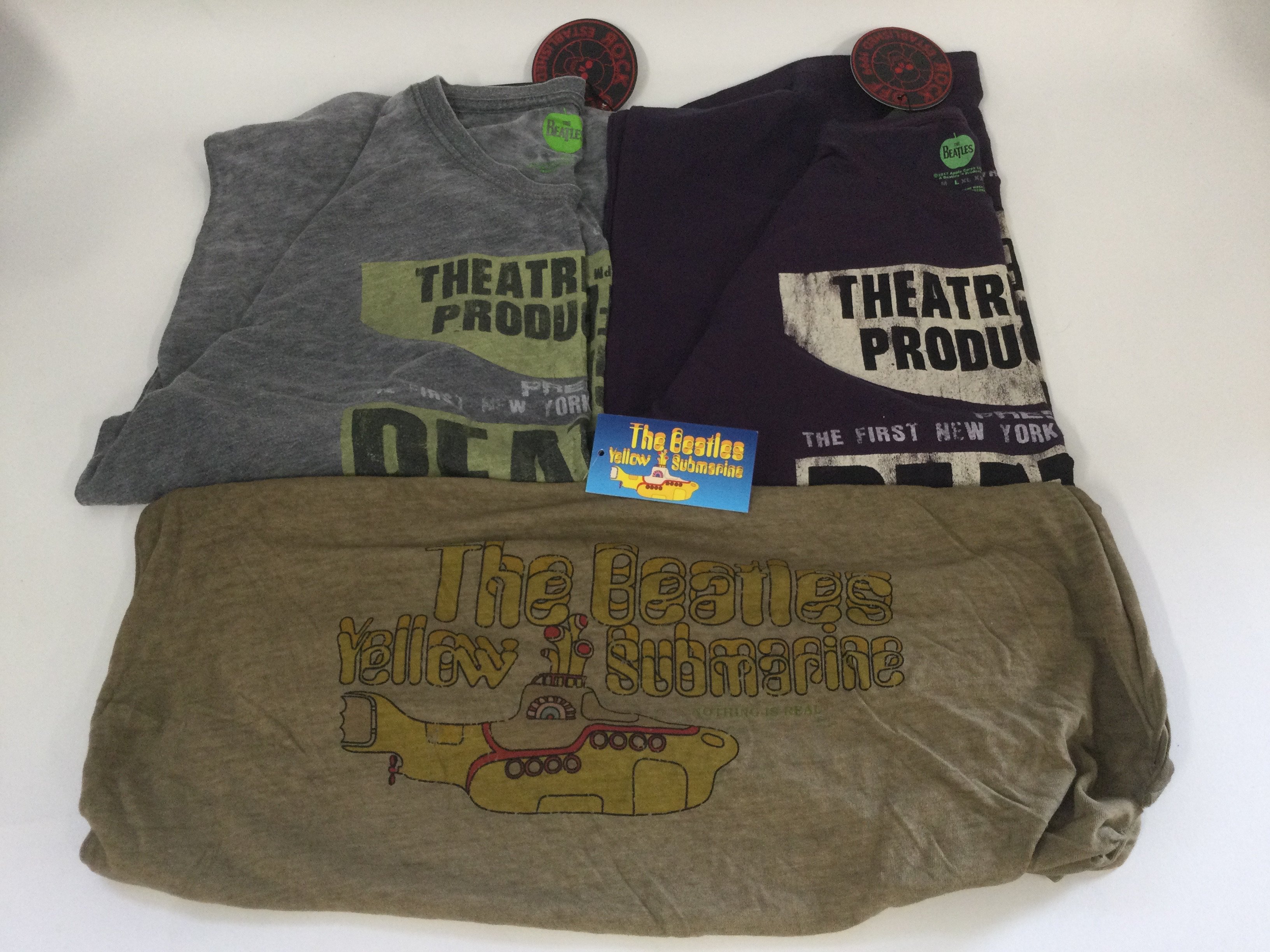 A collection of band T shirts comprising The Beatles and Pink Floyd. Sizes L and XL.