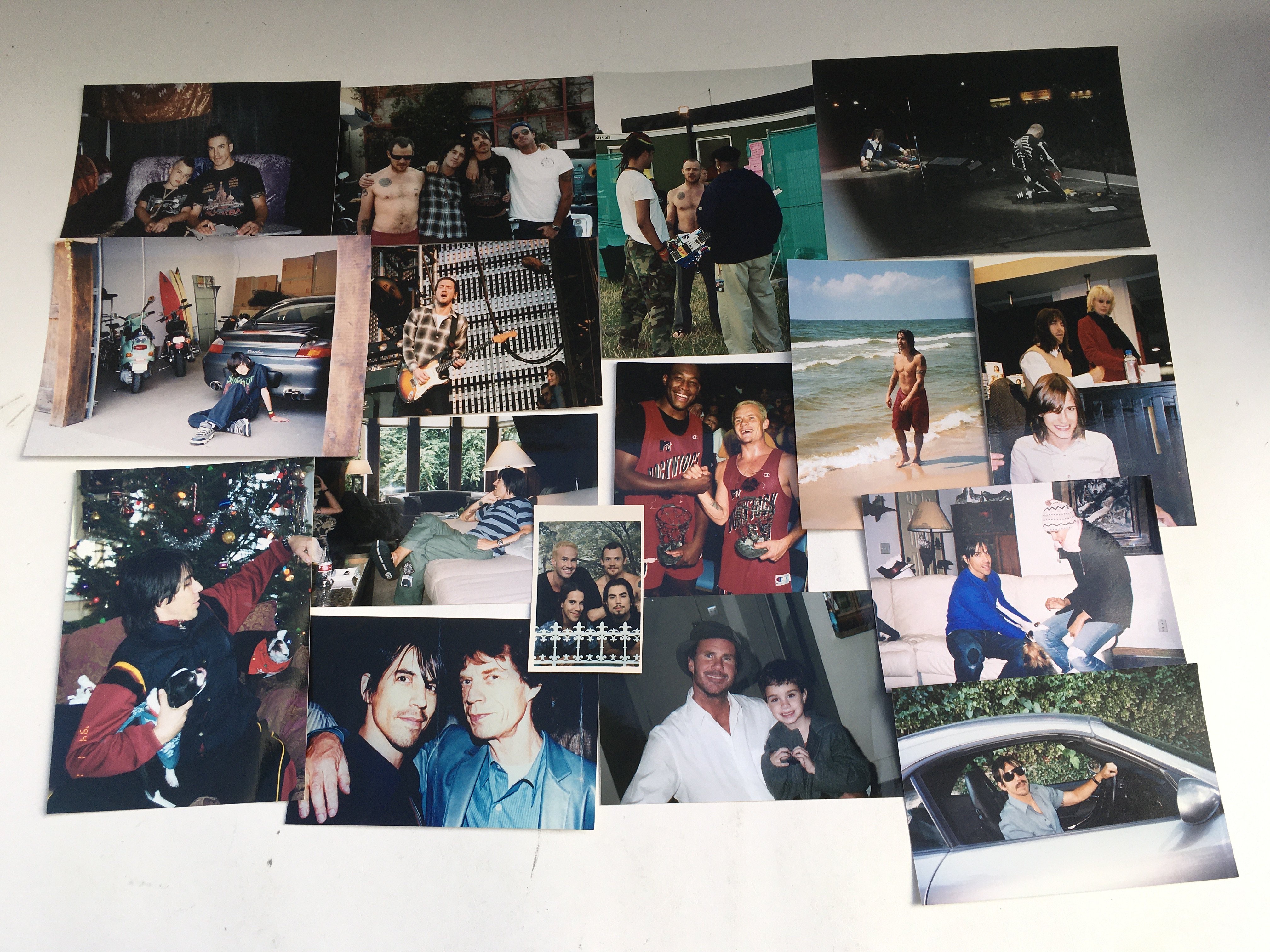 A collection of Red Hot Chili Peppers ephemera including a unique collection of photographs given to the vendor by Anthony Keidis' father, a stage used drumstick signed by Chad Smith, All access tour laminate, tour itinerary booklets and other items. The vendor was a truck driver for their European tours in 2006-2011. Further provenance available upon request.