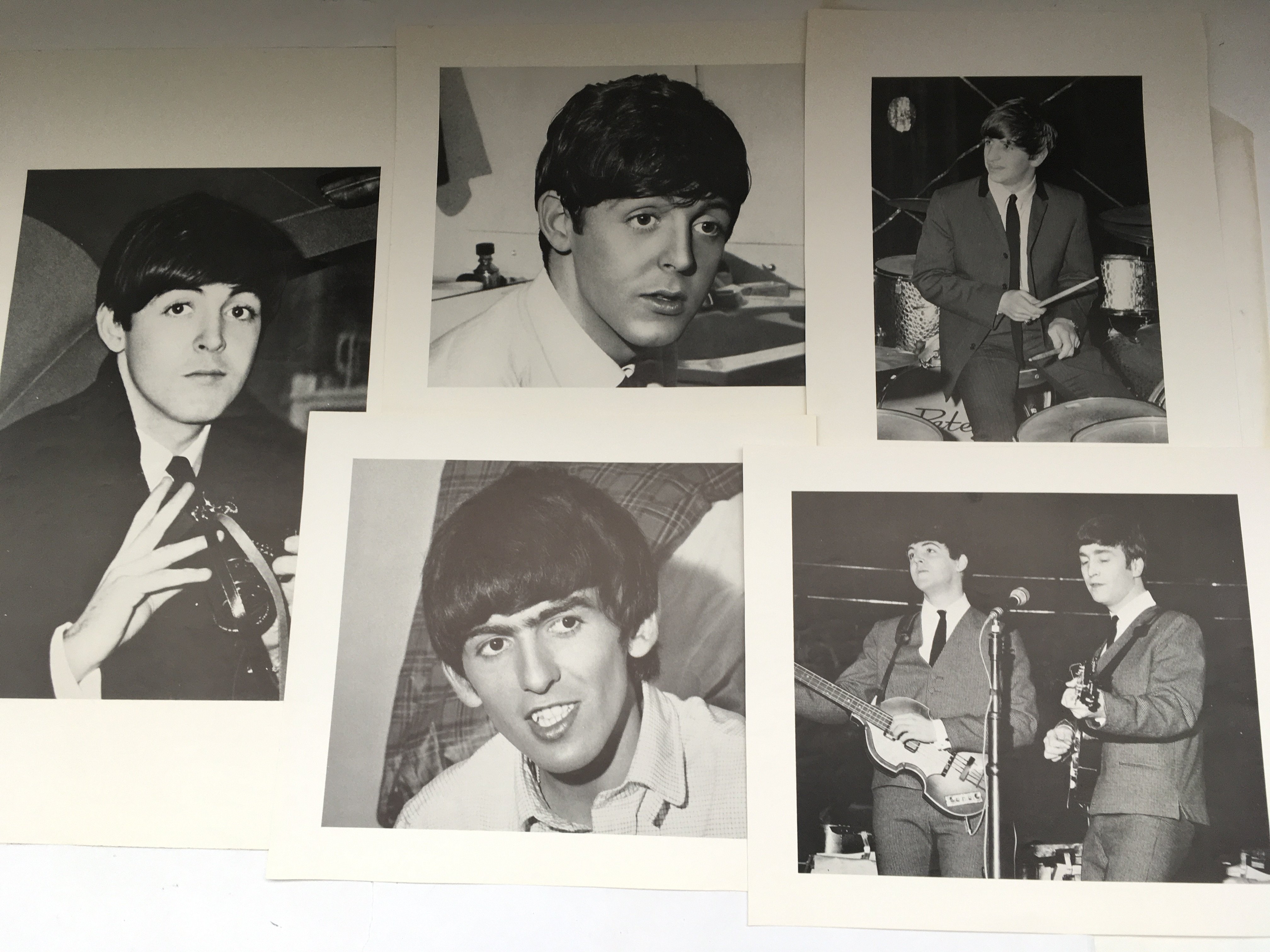 A collection of Beatles ephemera comprising early 1960s press photos and publications.