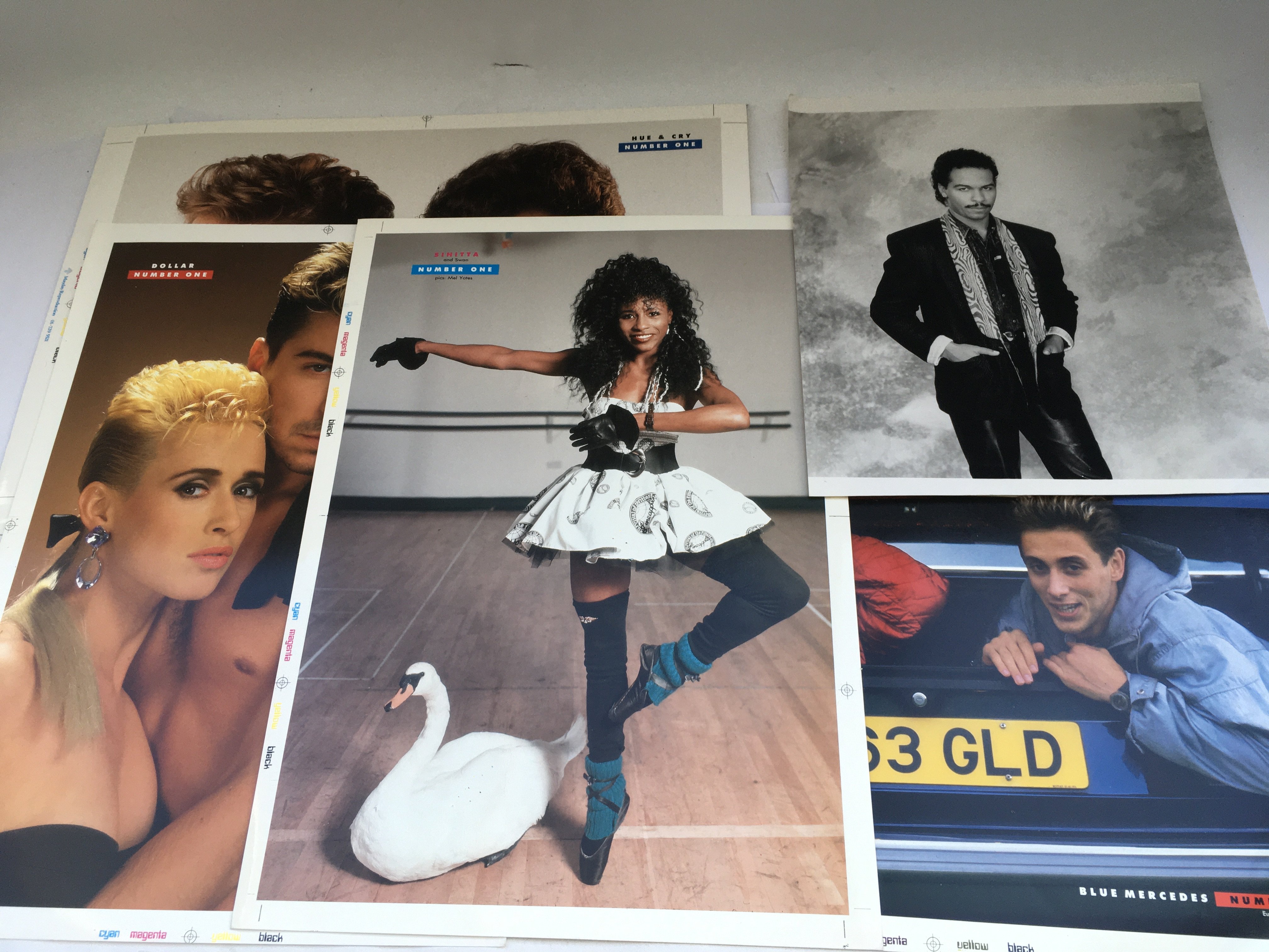 A collection of 1980s Number One magazine pre production photos of various pop acts plus x12 Spice Girls posters.