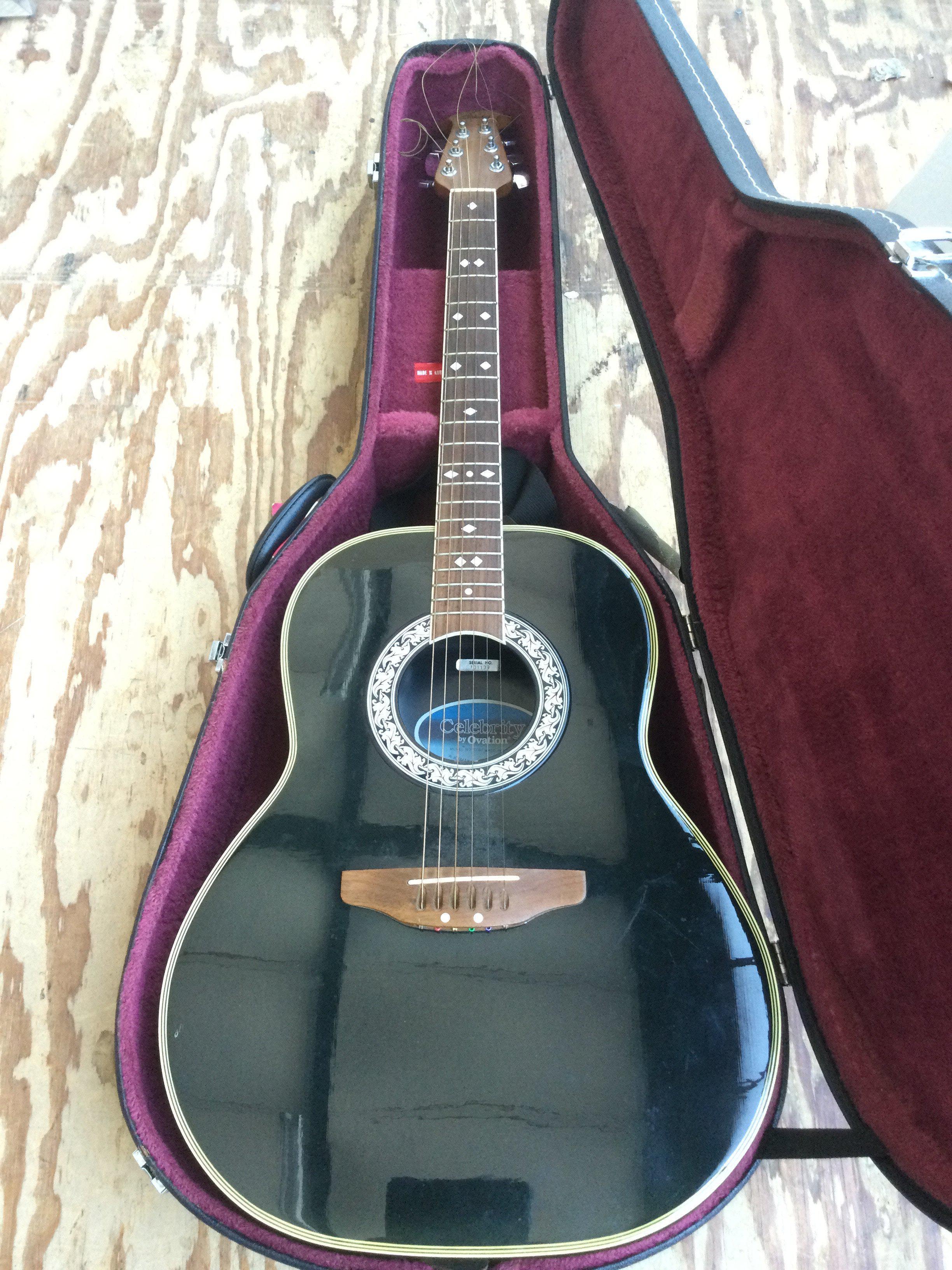 An Ovation Celebrity bowl back acoustic guitar with hard carry case.