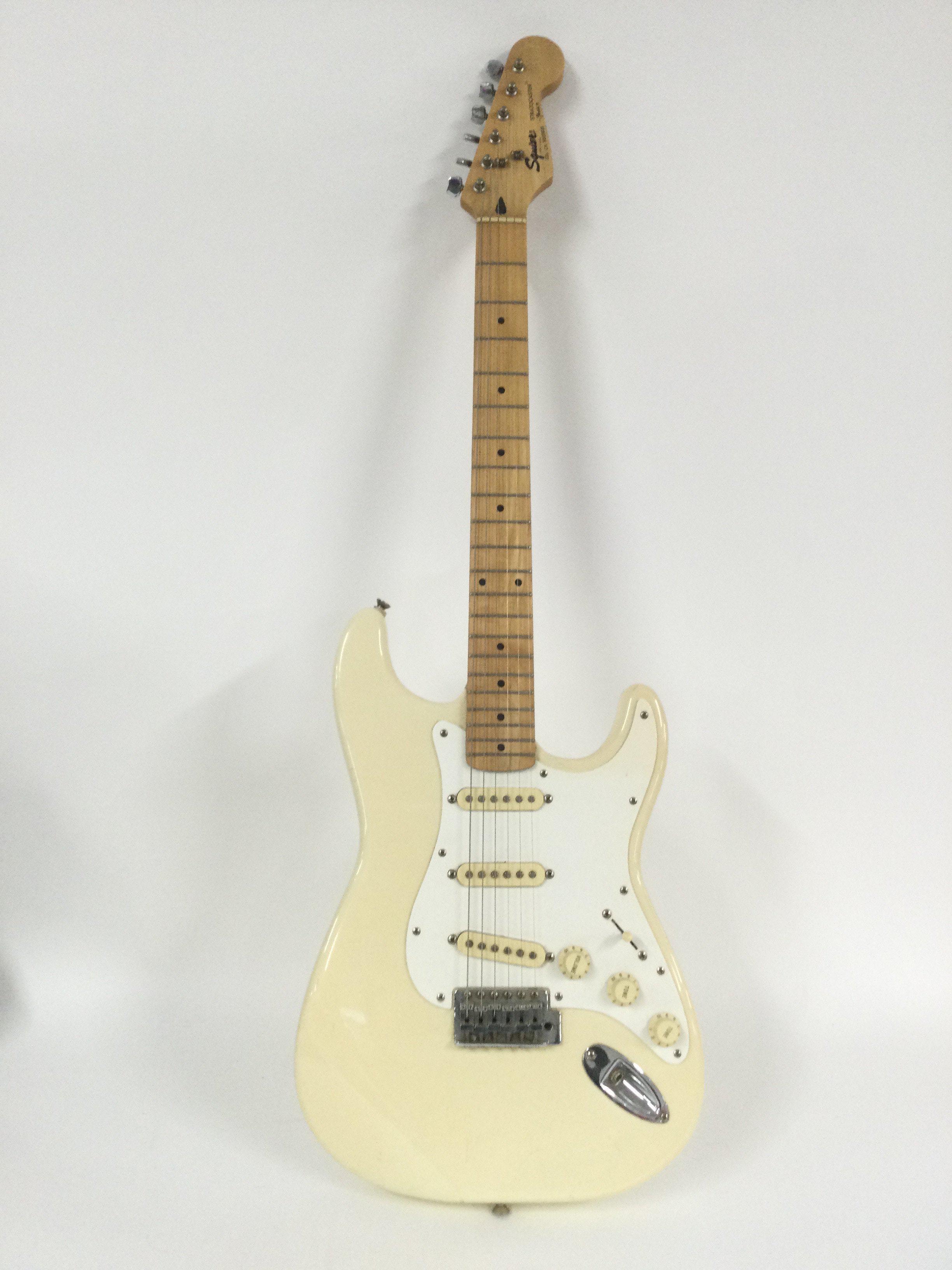 A Fender Squier Stratocaster electric guitar, no case.