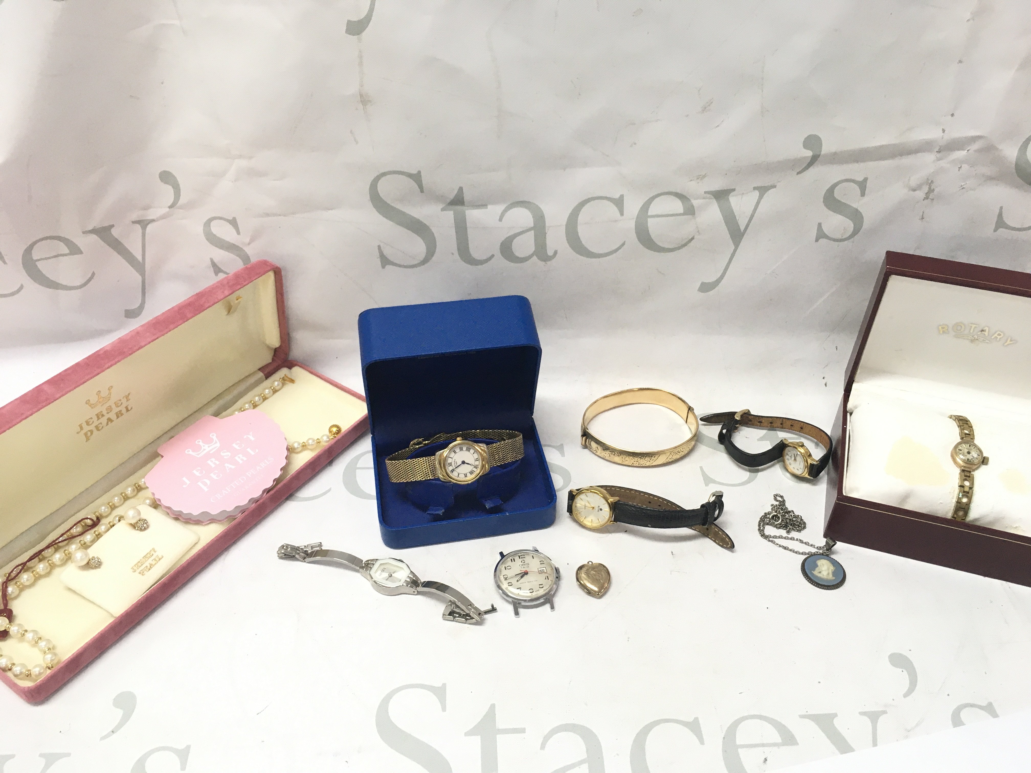 Mixed collection of watches including Rotary , boxed Jersey pearl necklace and earrings etc. postage catB