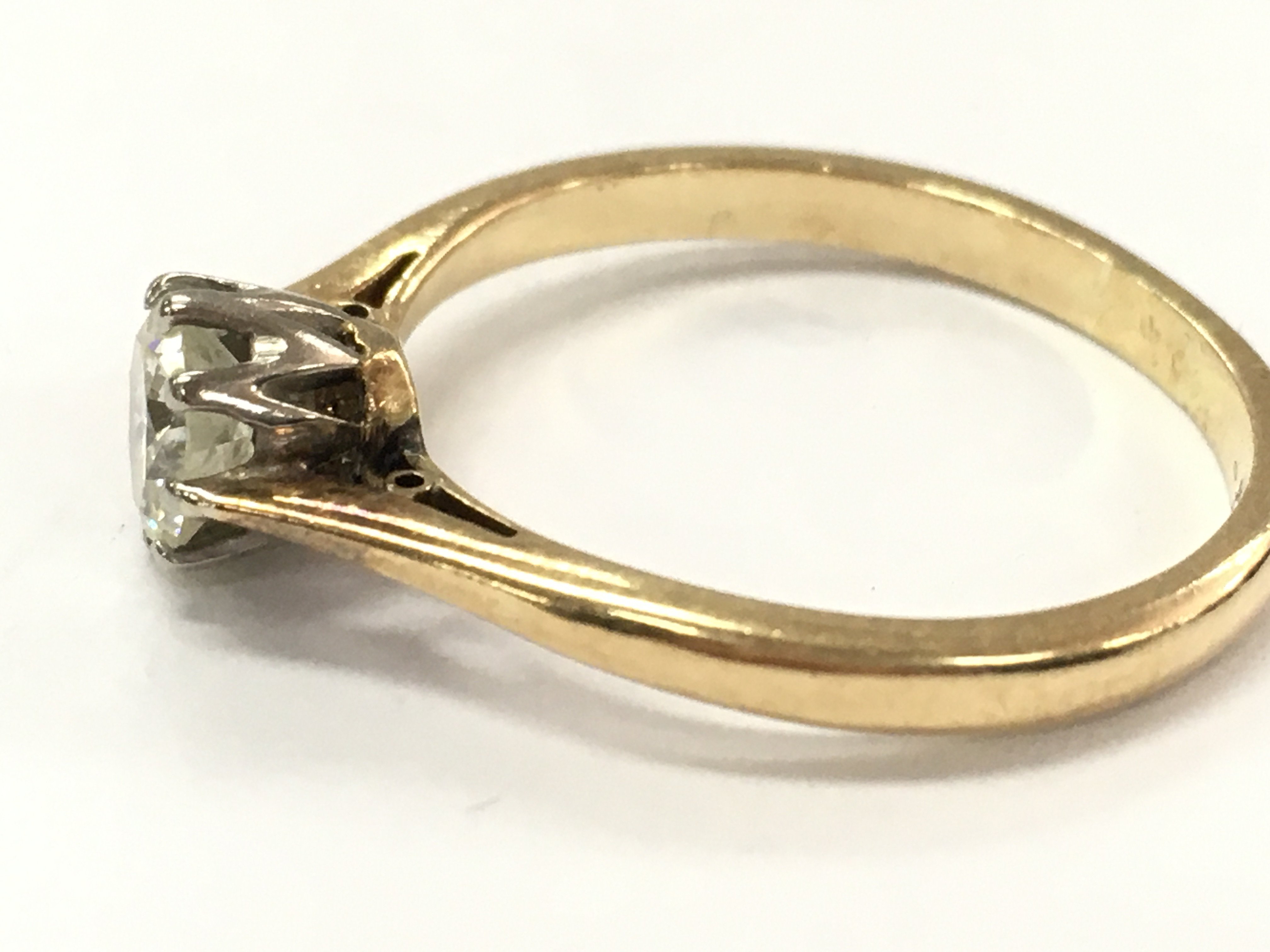 An unmarked 18ct diamond ring , 3.0g total weight Approx 60pts diamond . Ring size P. Postage category A