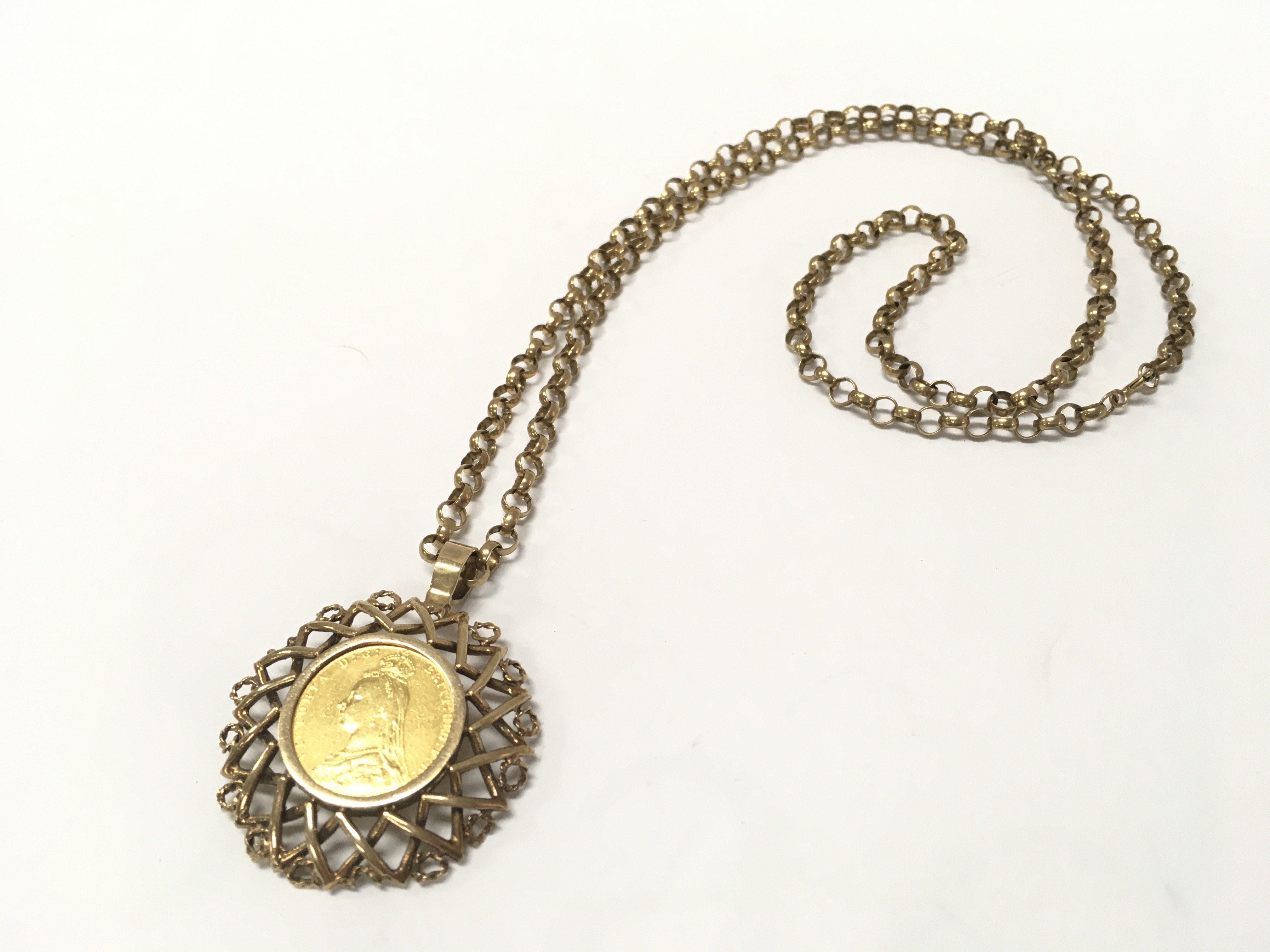 withdrawn - An 1889 sovereign in a 9ct gold mount with a 9ct gold belcher chain. 35.3G total weight. Postage category A