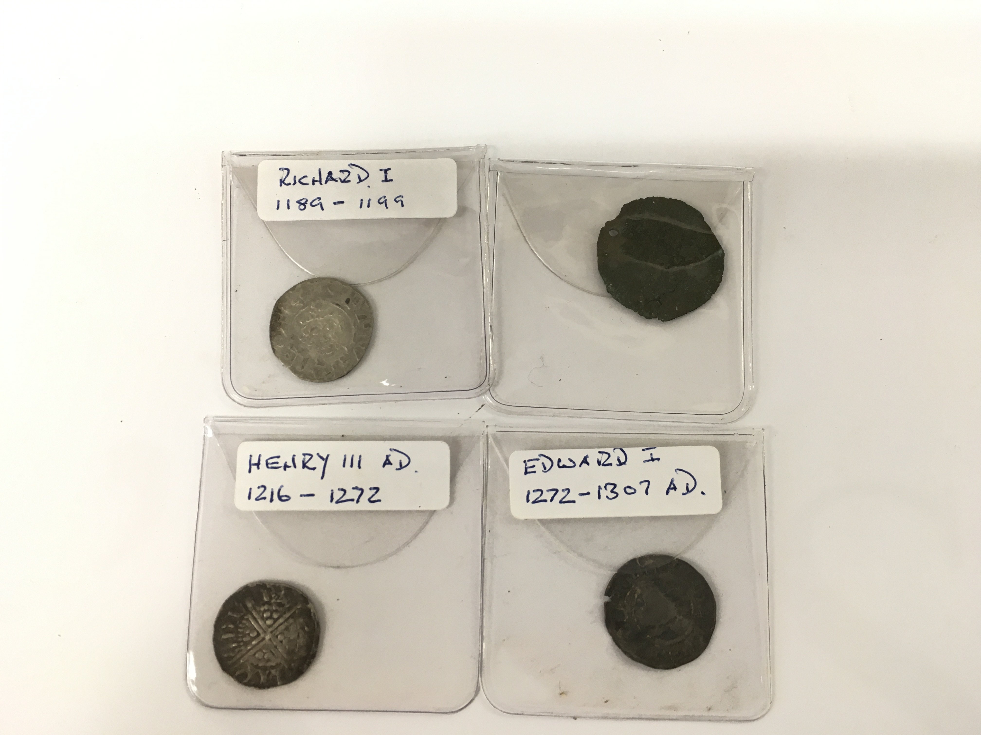 Four early hammered coins including a silver penny.