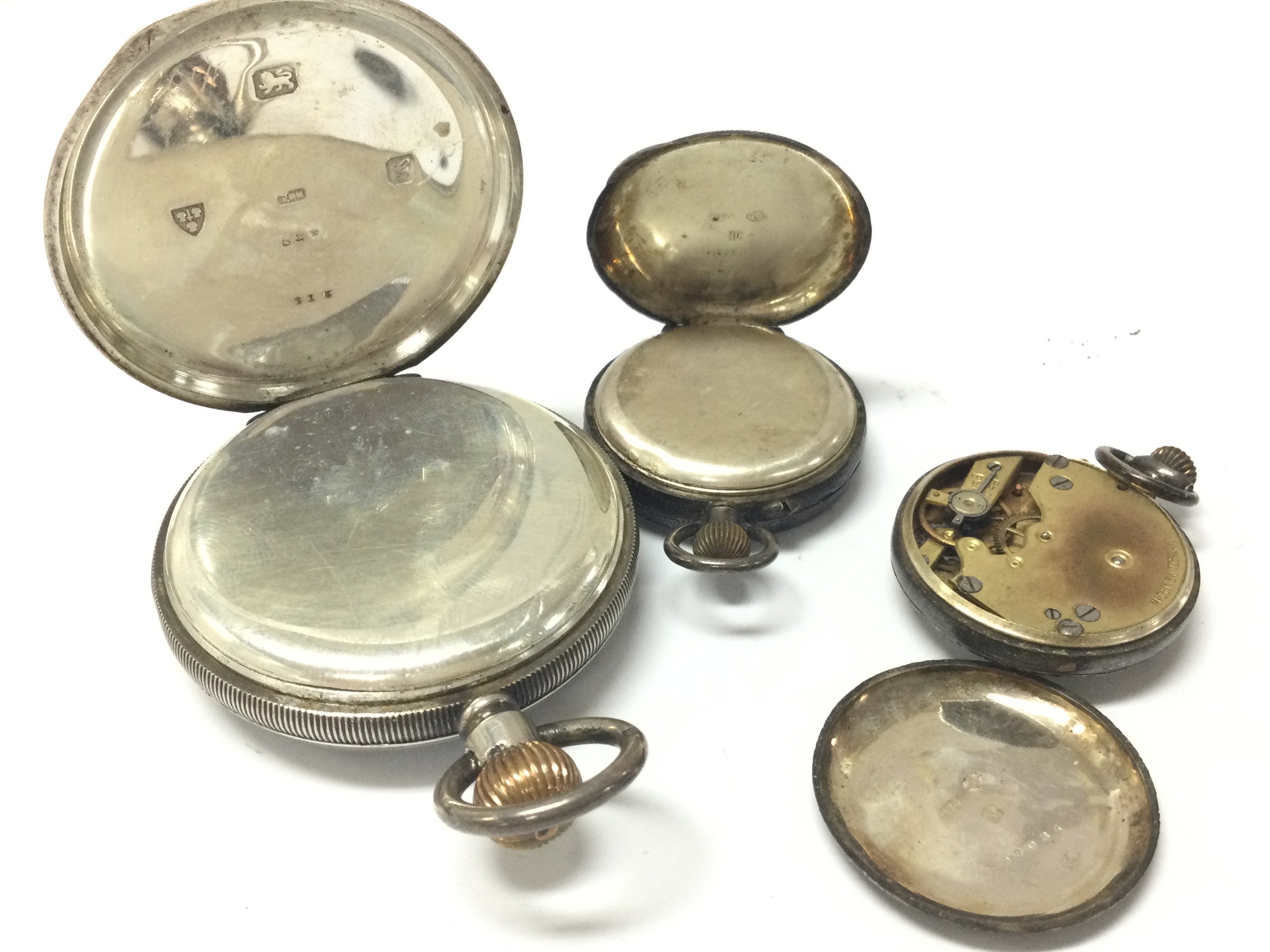 A hallmarked silver pocket watch , two silver ladies pocket watches, one chrome plated. Postage category B NO RESERVE