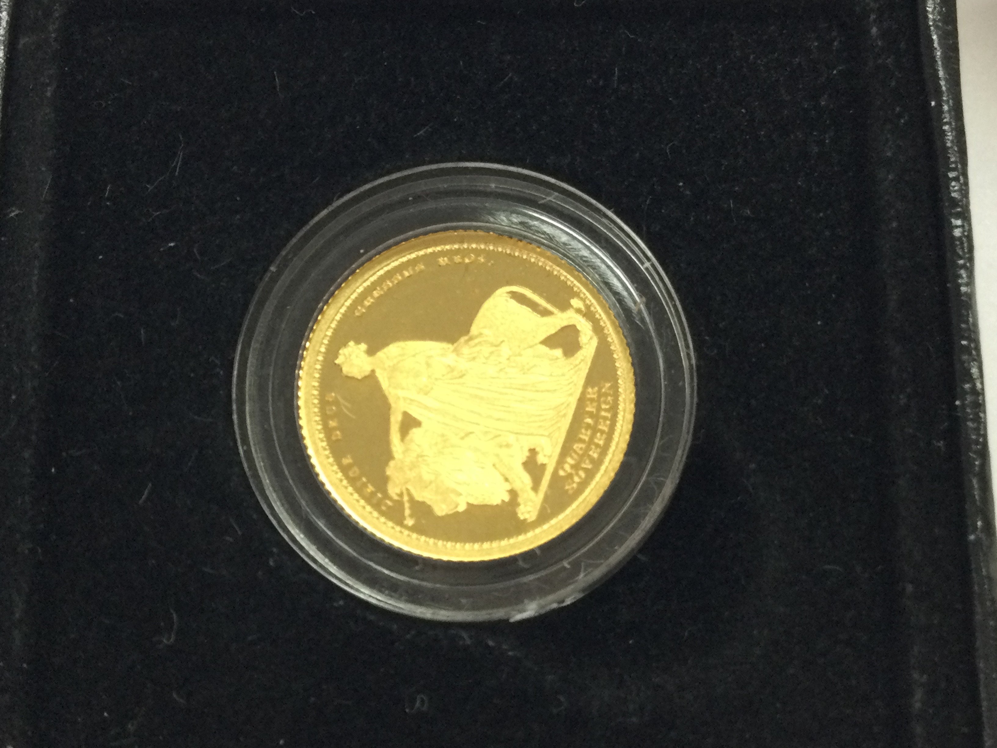 A gold quarter sovereign.
