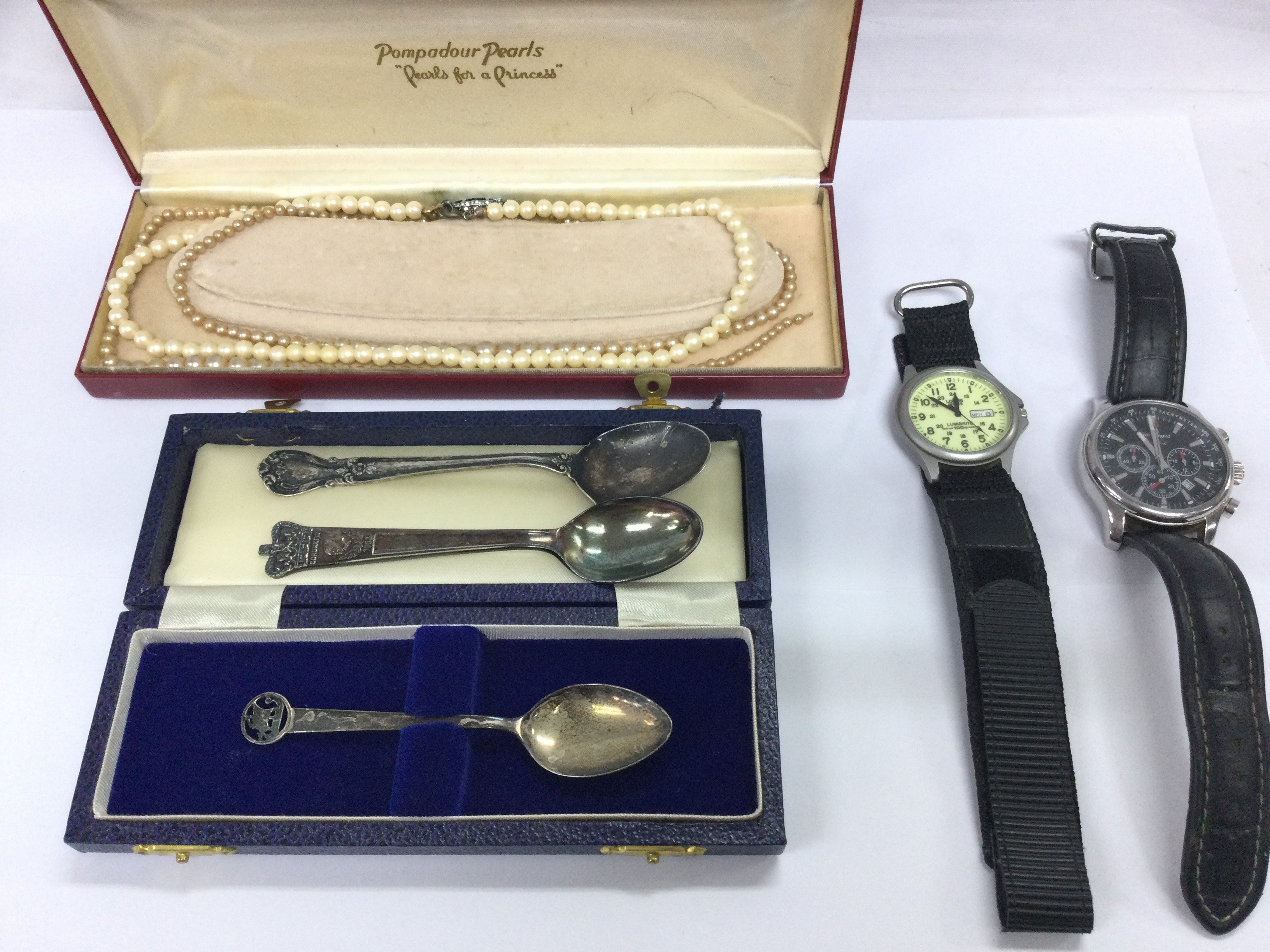 A collective lot including simulated pearls watches and spoons including silver and silver plate.