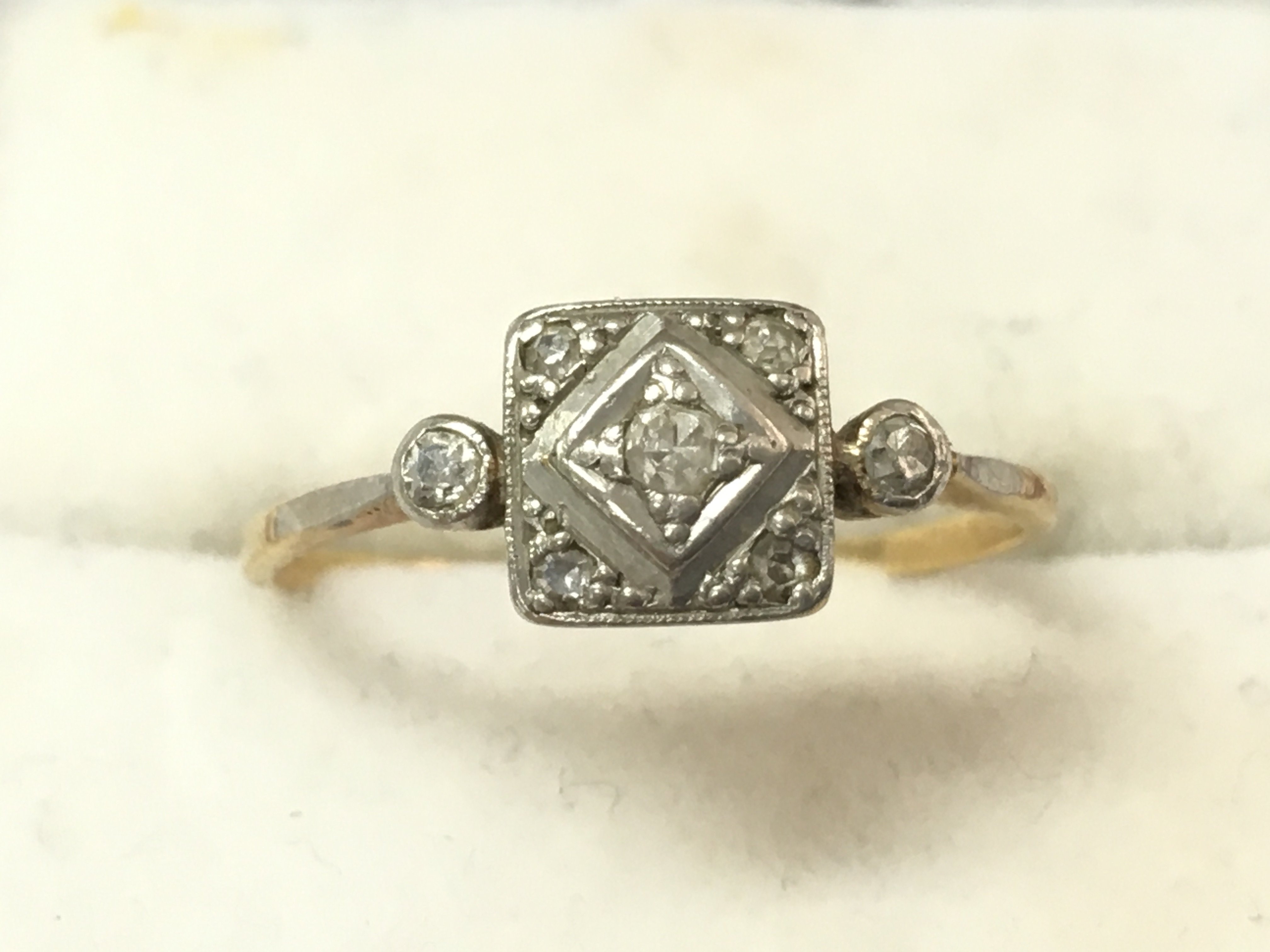 An unmarked 18ct gold and diamond set ring, size N/M. 1.7g total weight. Postage catA