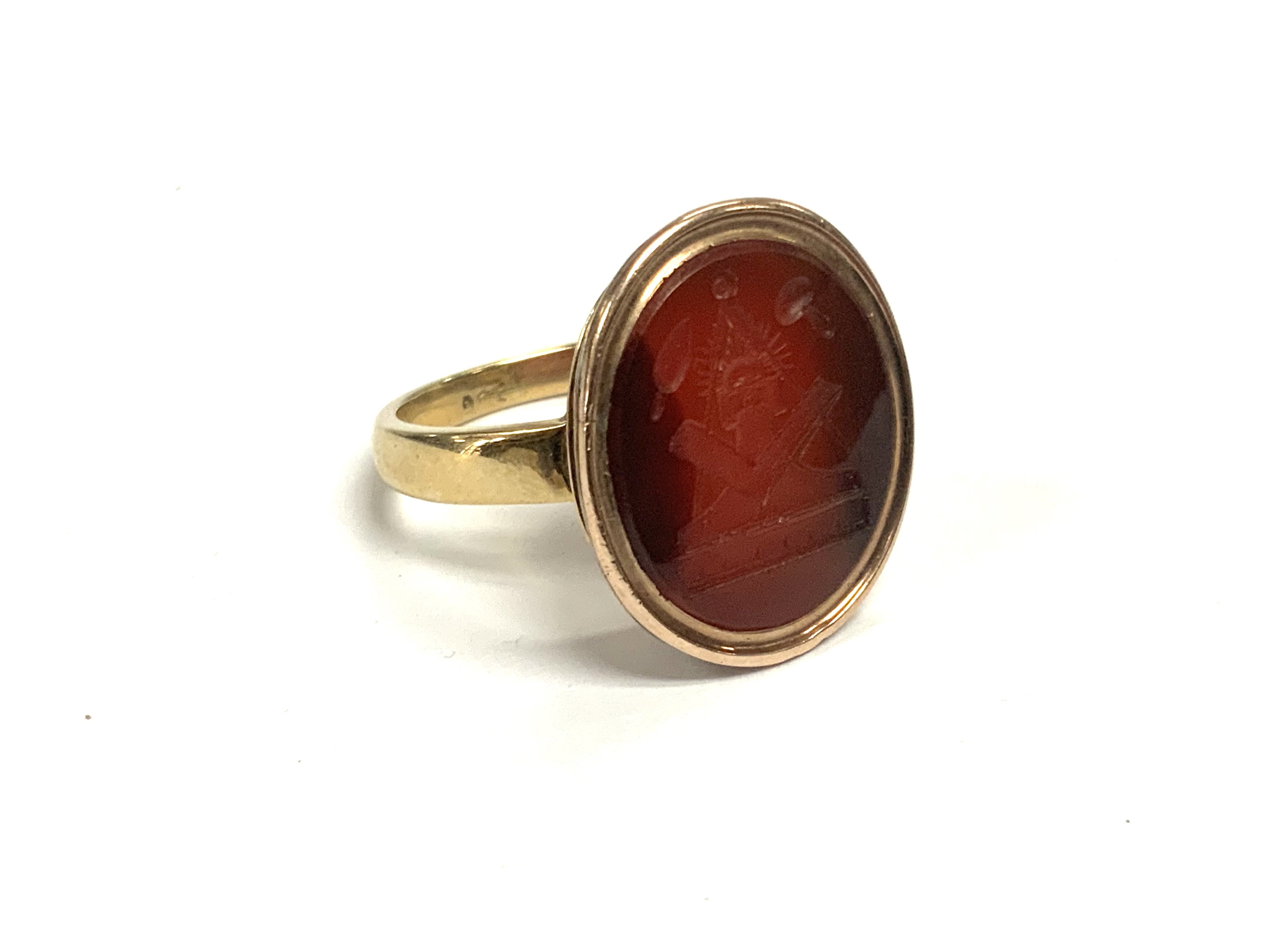 A 9ct Gold & Carnelian Carved Intaglio Ring with Masonic symbols. 8.69g, Size S.