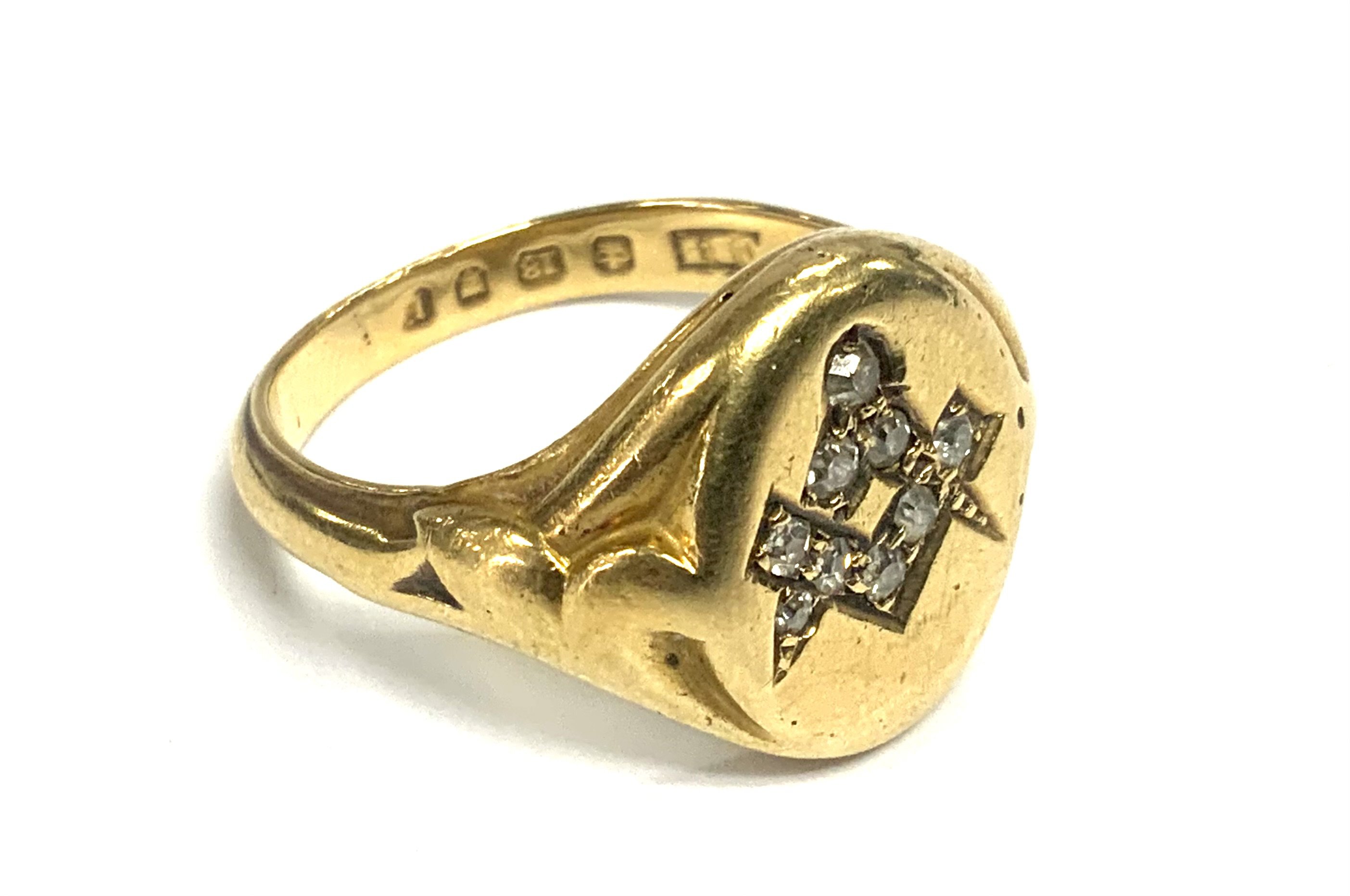 A heavy gents 18ct gold signet ring inset with a pattern of diamonds of Masonic form. 9.7g, Size S. (A)
