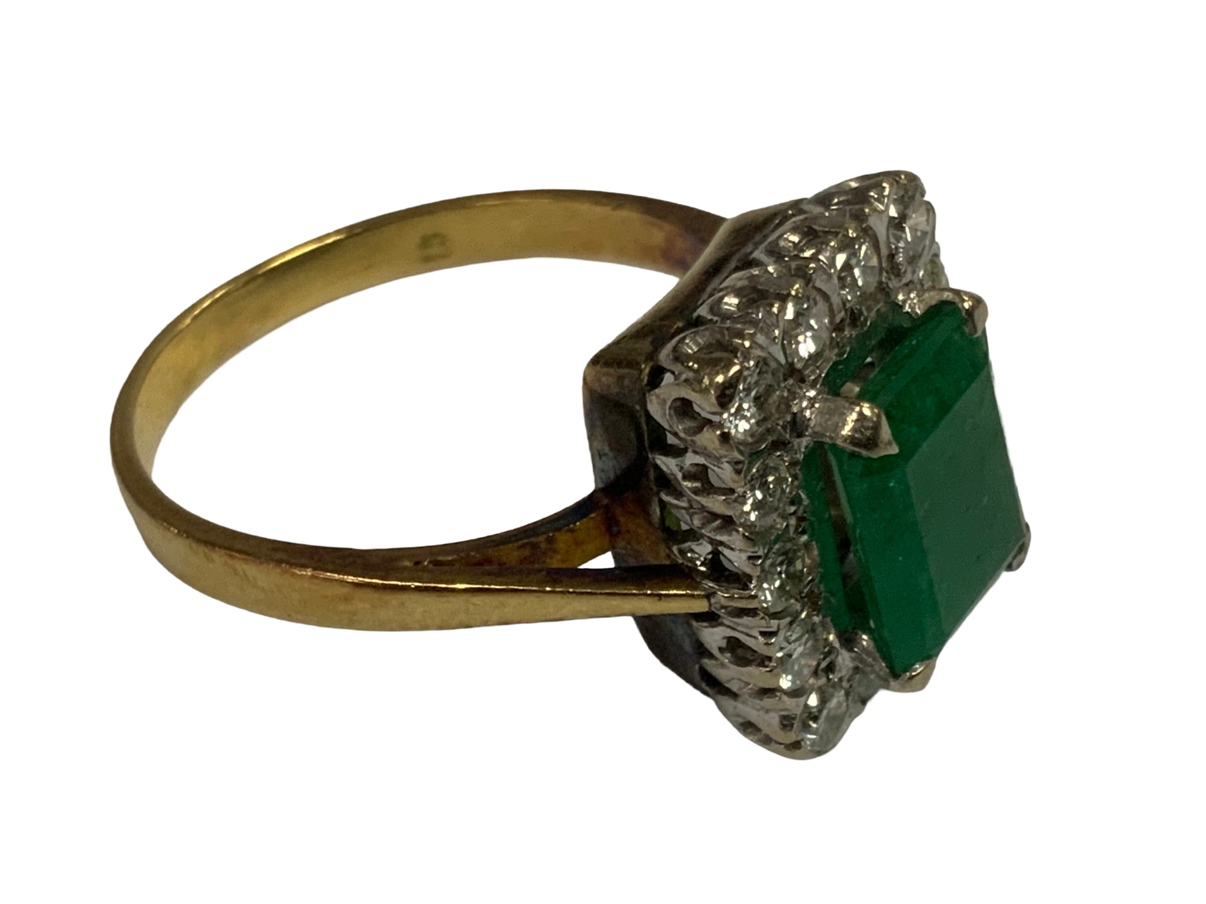 18ct Emerald and Diamond cluster ring.
