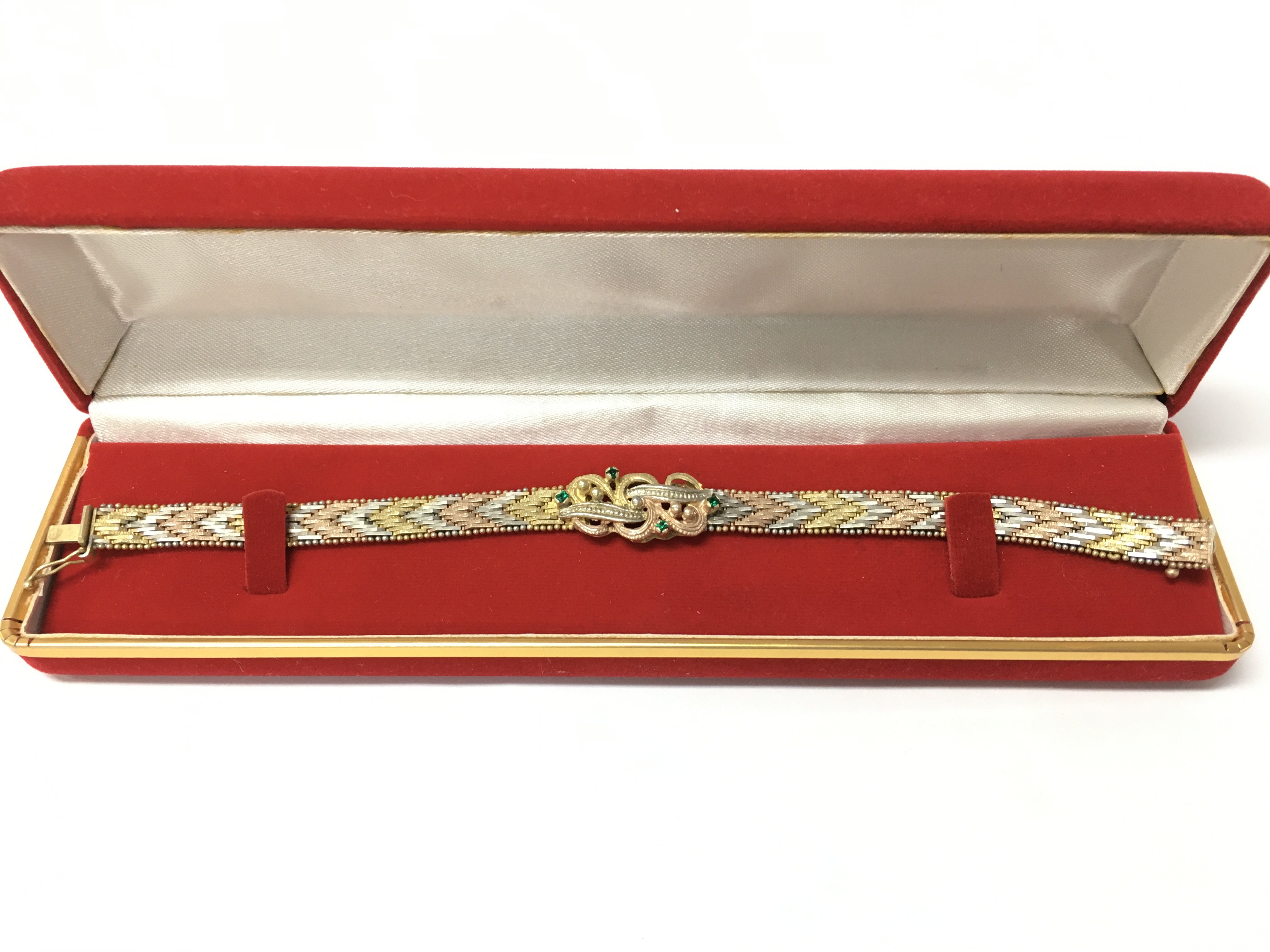A three colour silver gilt bracelet , postage category A