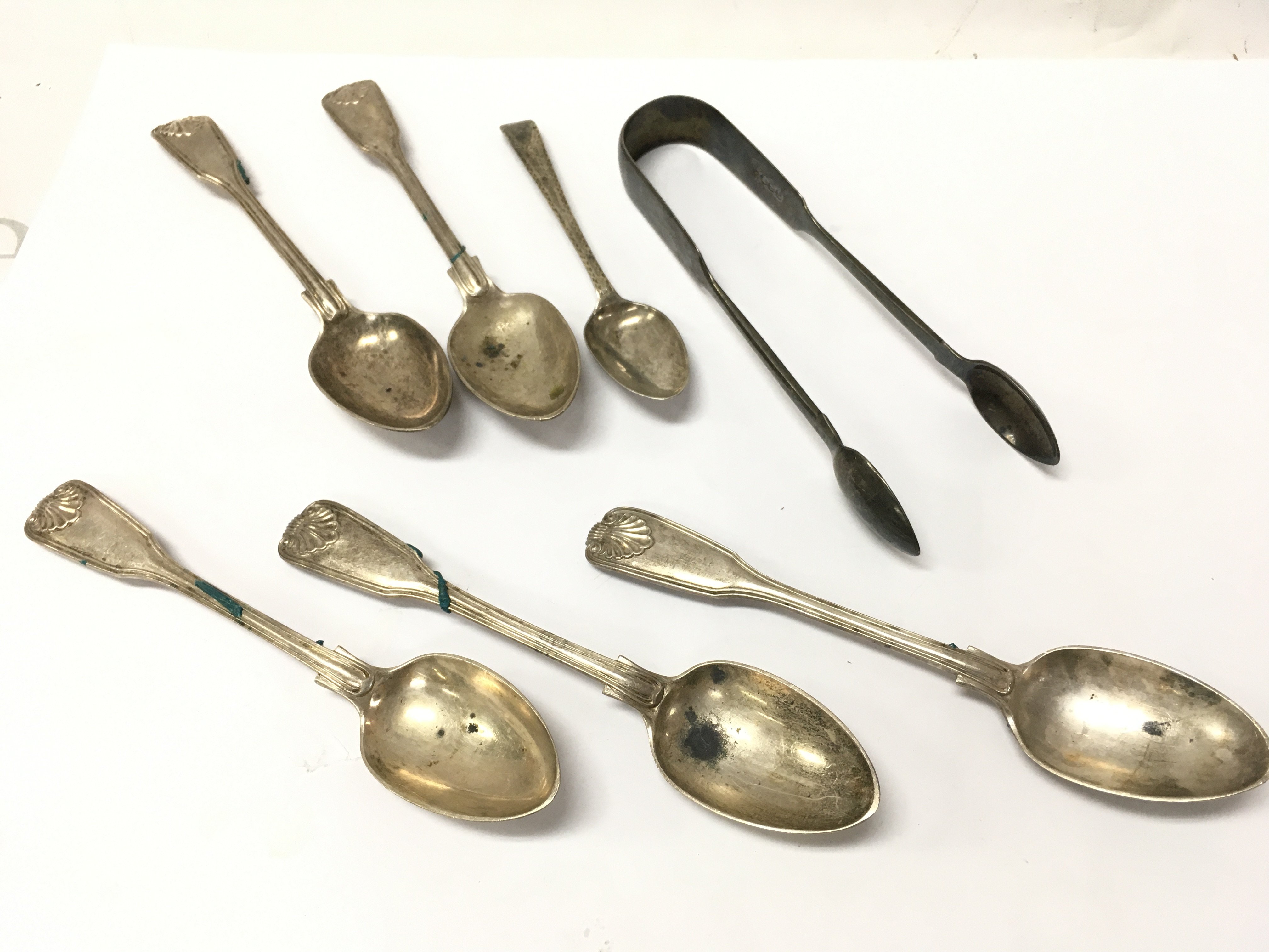 Hallmarked silver spoons and sugar tongs , postage category A