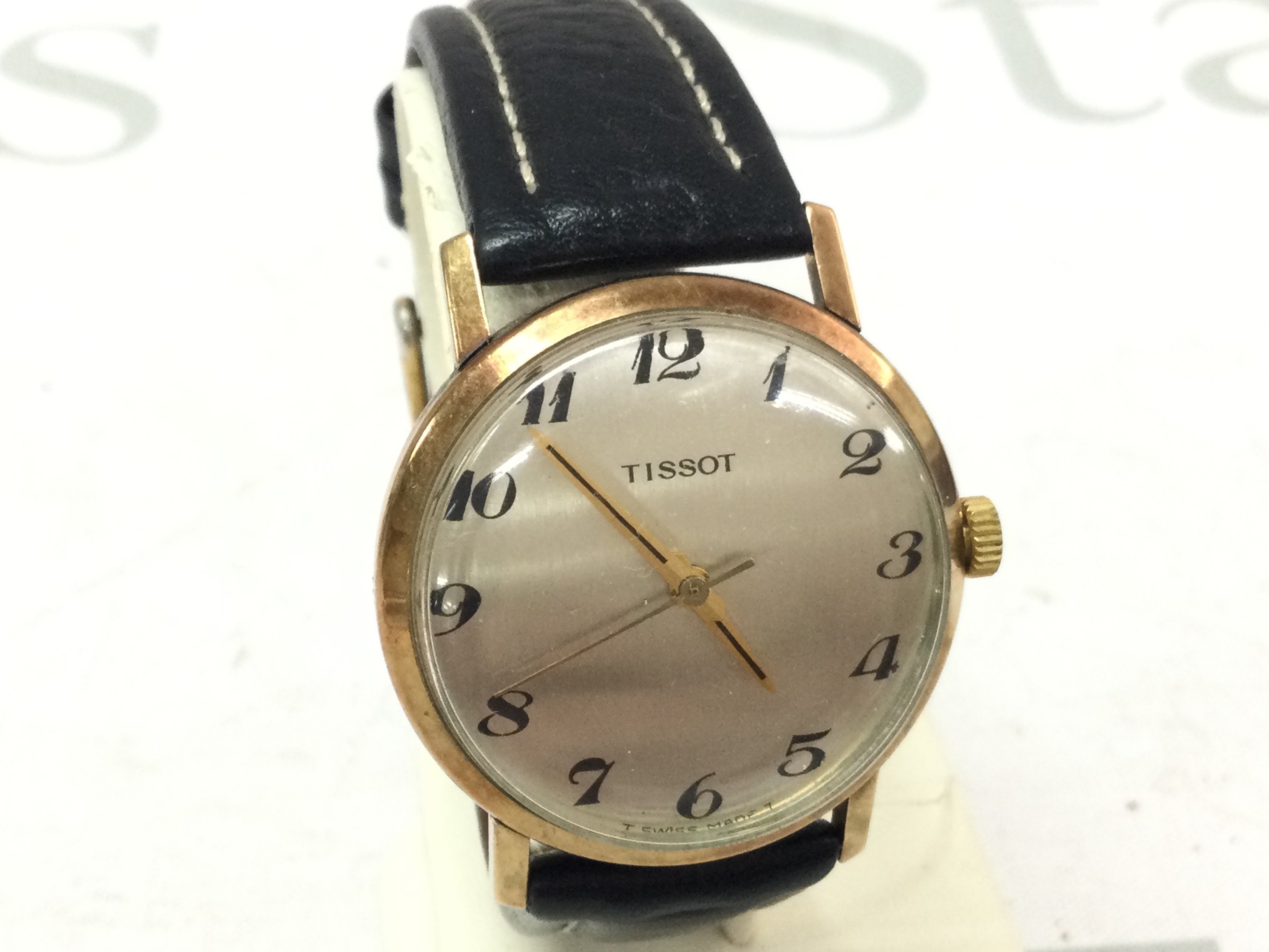 A Tissot 9ct gold vintage gents wristwatch with convex glass and leather strap (working)