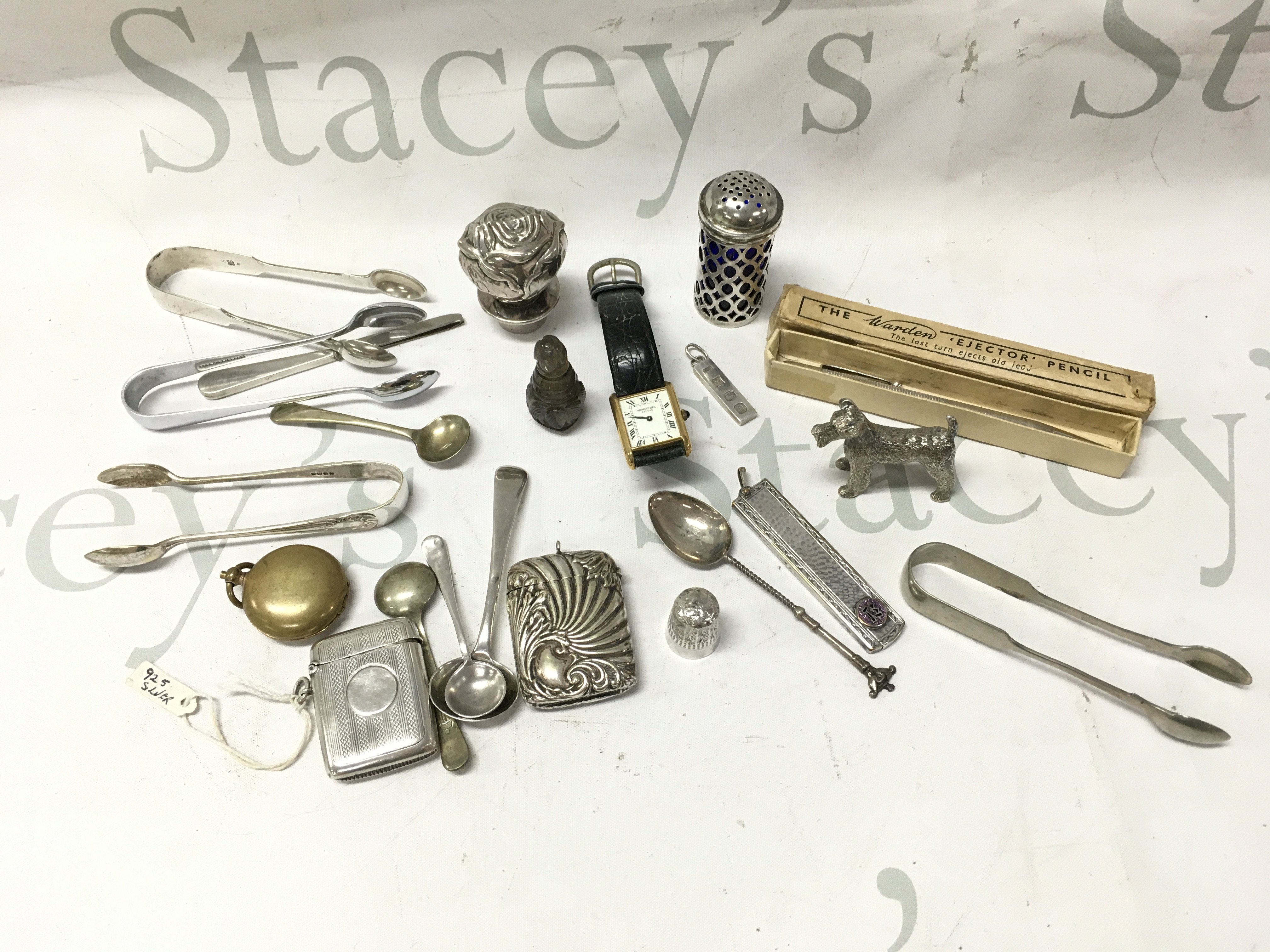 A mixed lot of silver including a vesta case, spoon, boxed Warden Ejector pencil, silver plated items and A Raymond Weil watch . Postage cat b