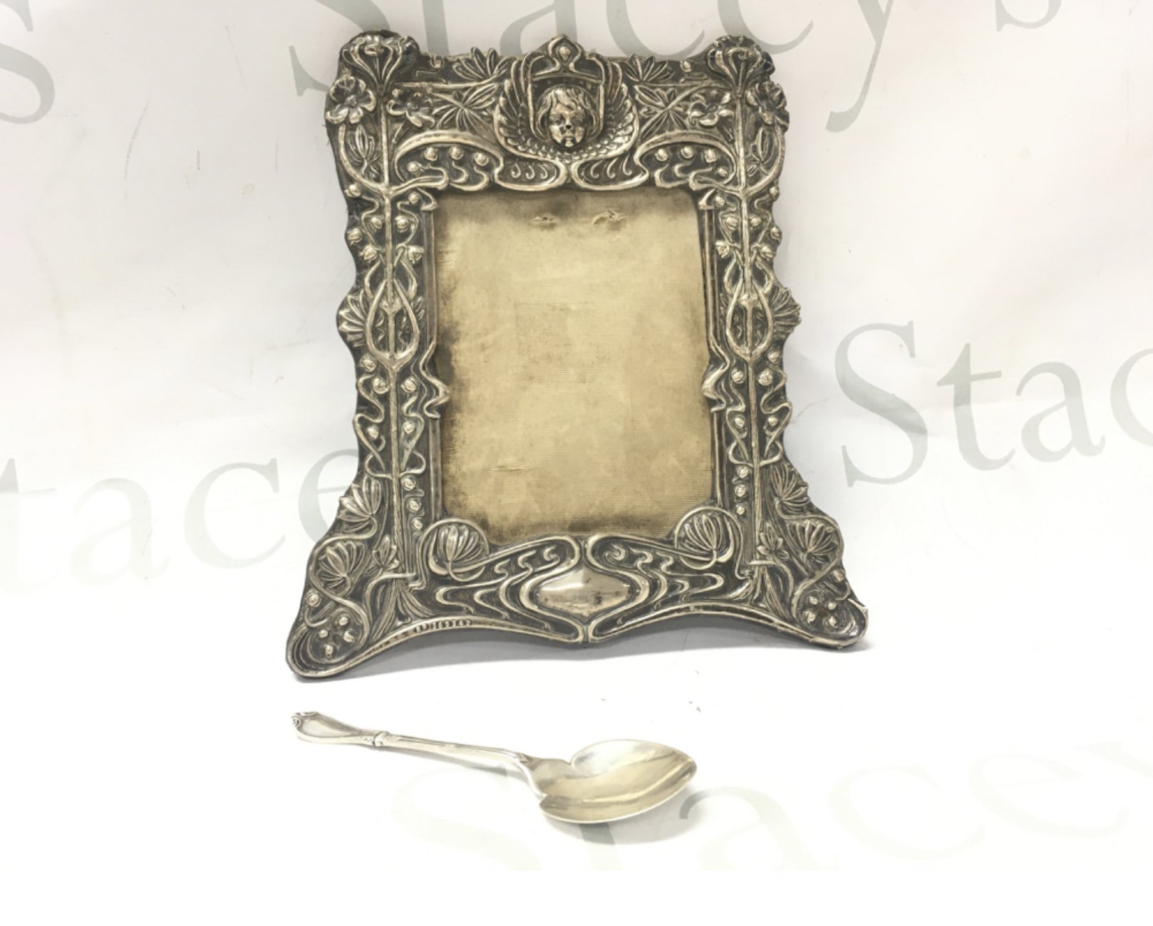 A vintage silver picture frame and a silver hallmarked spoon. Postage B