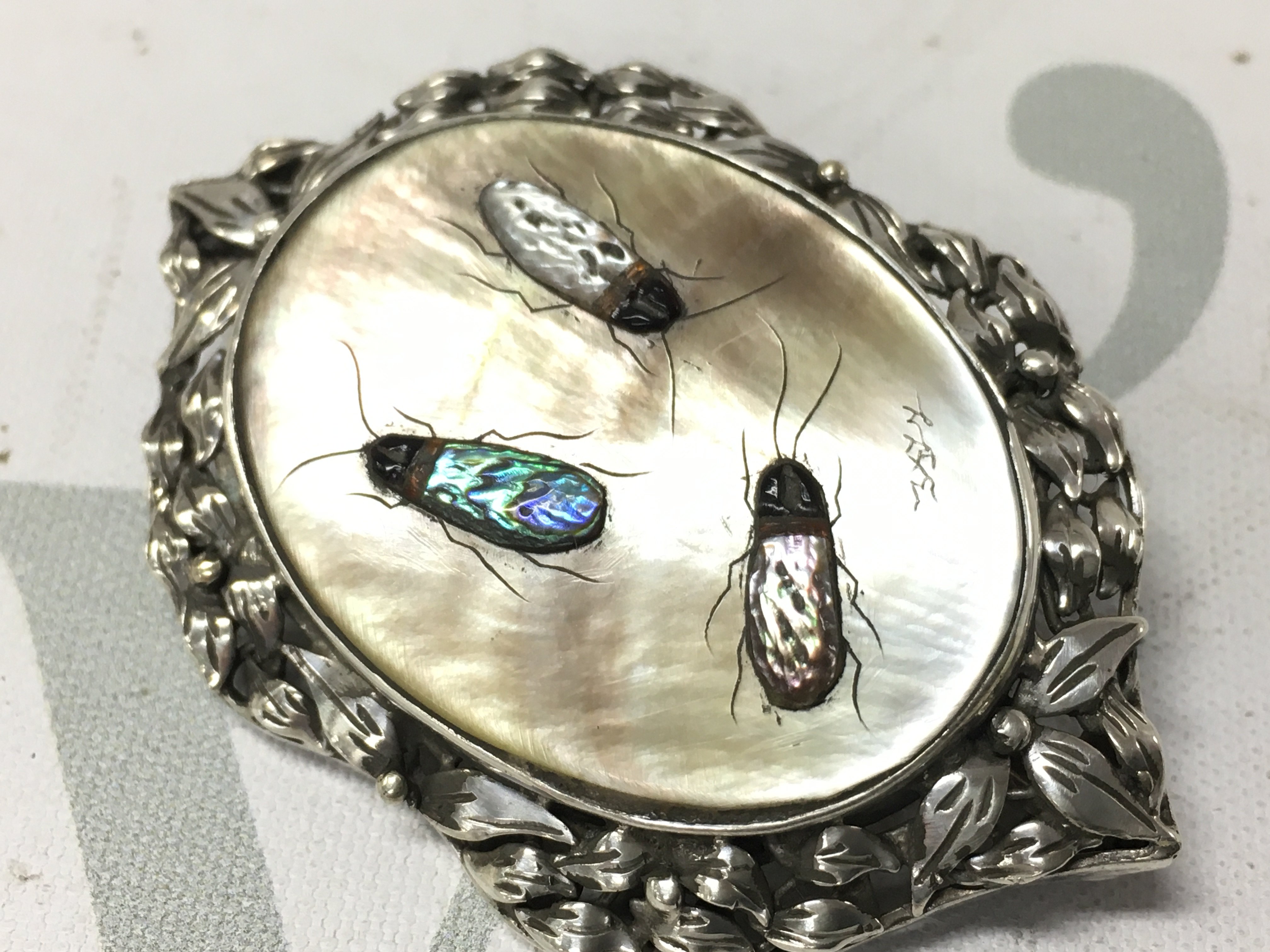 A silver shibayama bug brooch . Postage category a