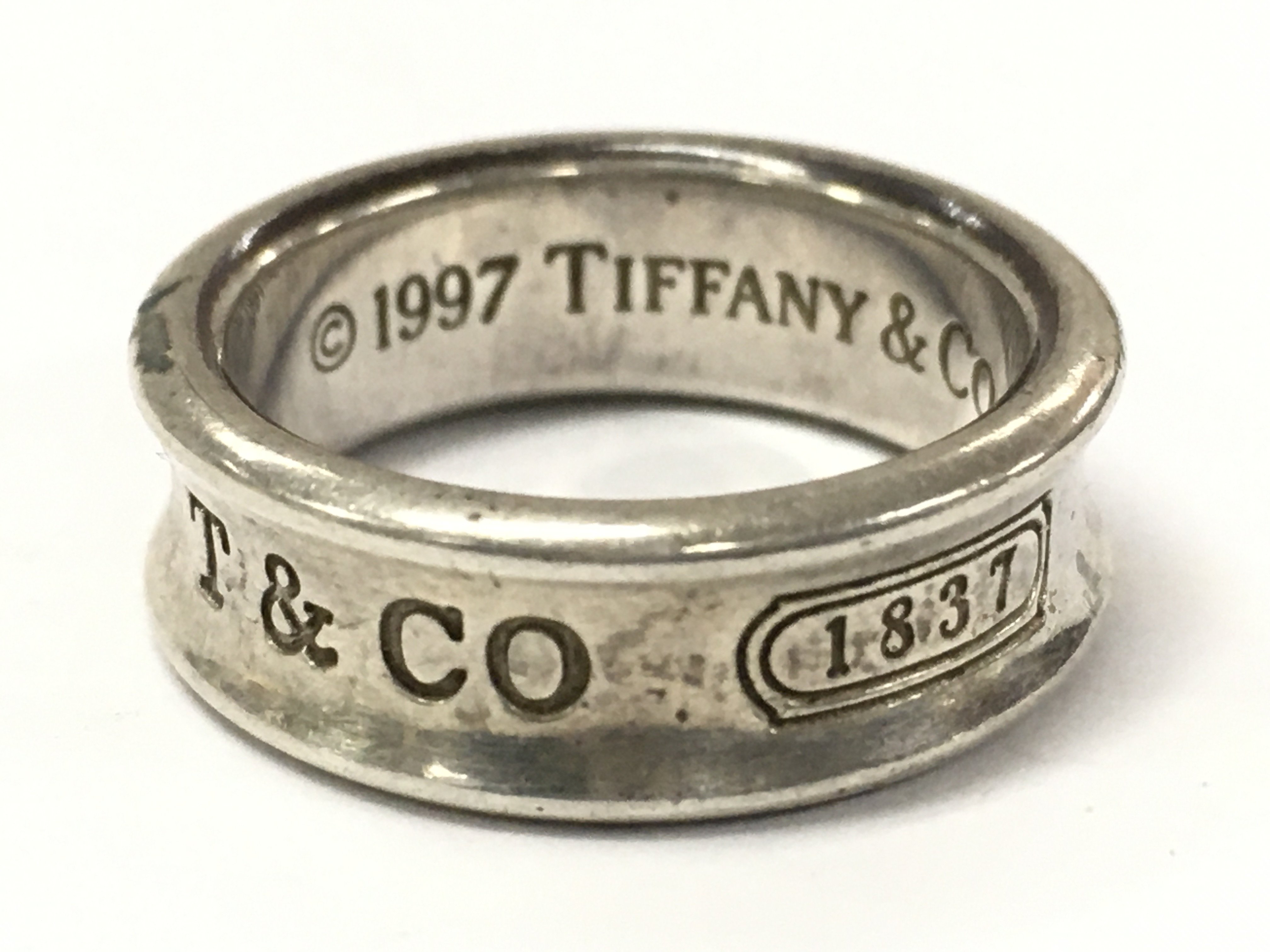 A fully hallmarked silver Tiffany & Co ring size O .postage category A