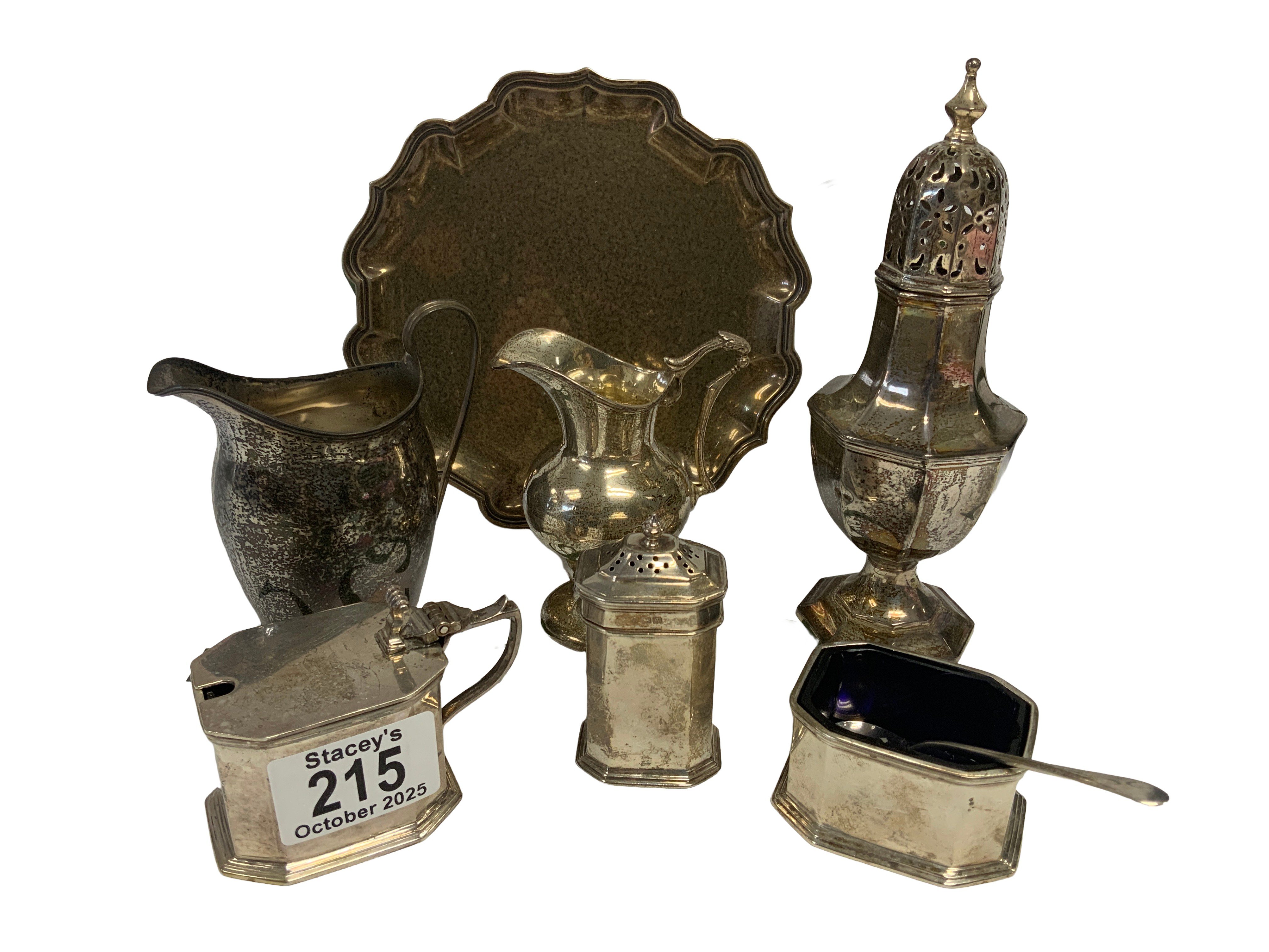 Hallmarked silver articles to include a 3 footed tazza, Sugar sifter, 2 small cream jugs, 3 piece cruet set. (D)