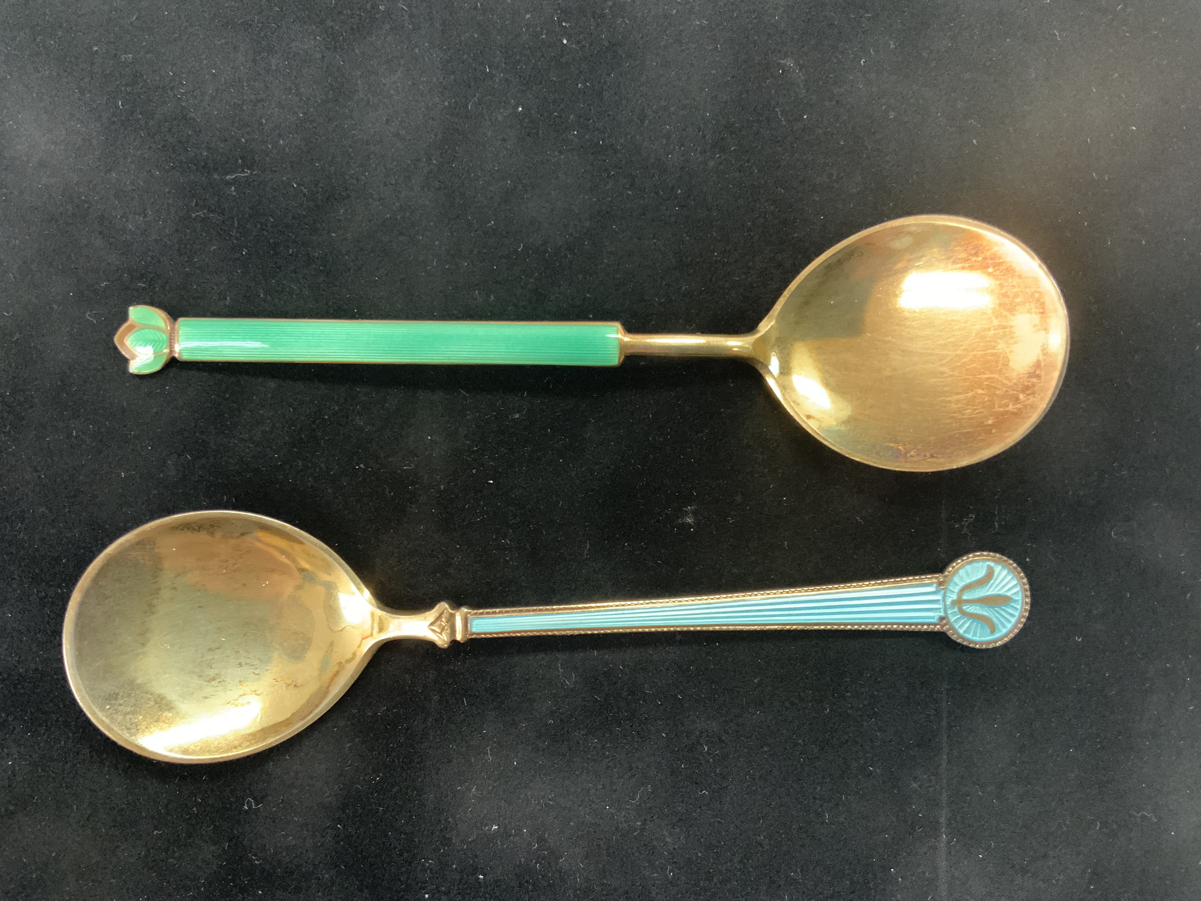 A David Andersen blue guilloche enamelled silver spoon together with a Norwegian guilloche enamel spoon. (A)