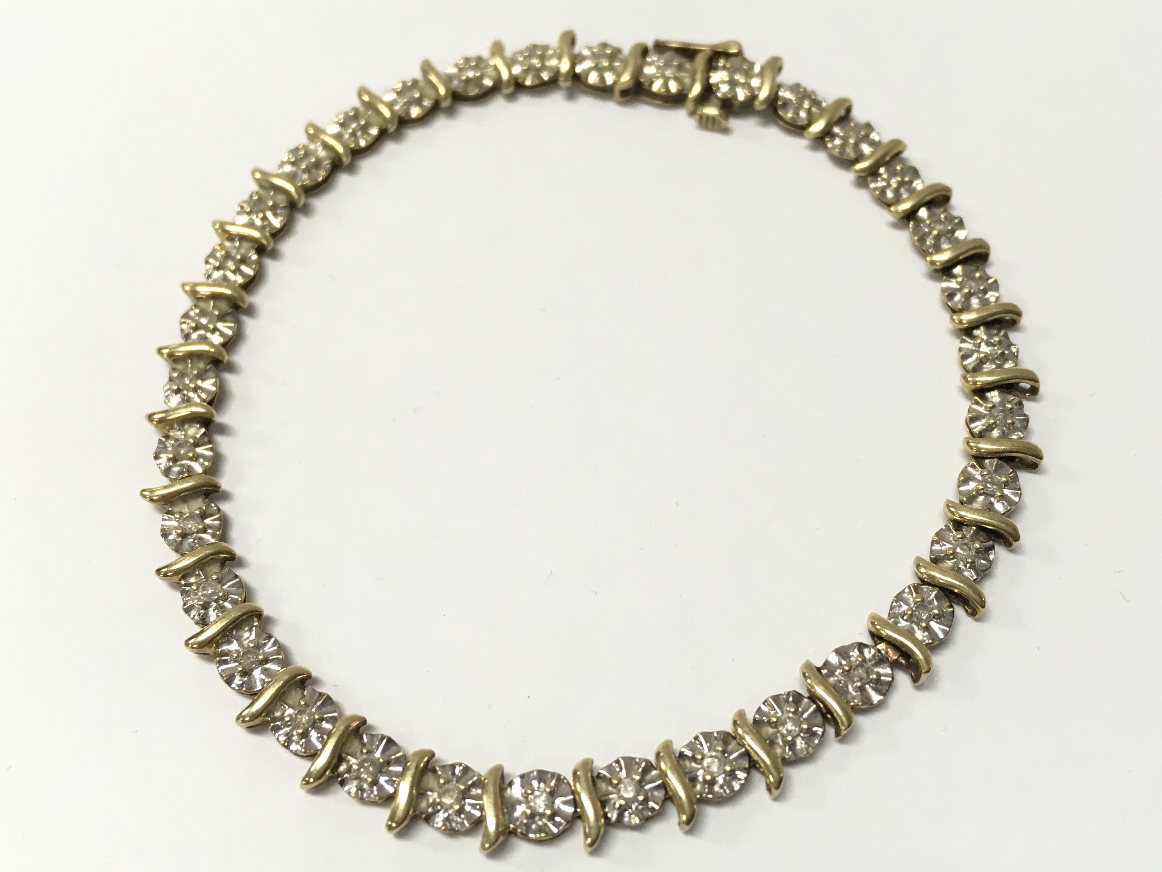 A 9ct gold bracelet, 6.5g total weight . Postage cat a