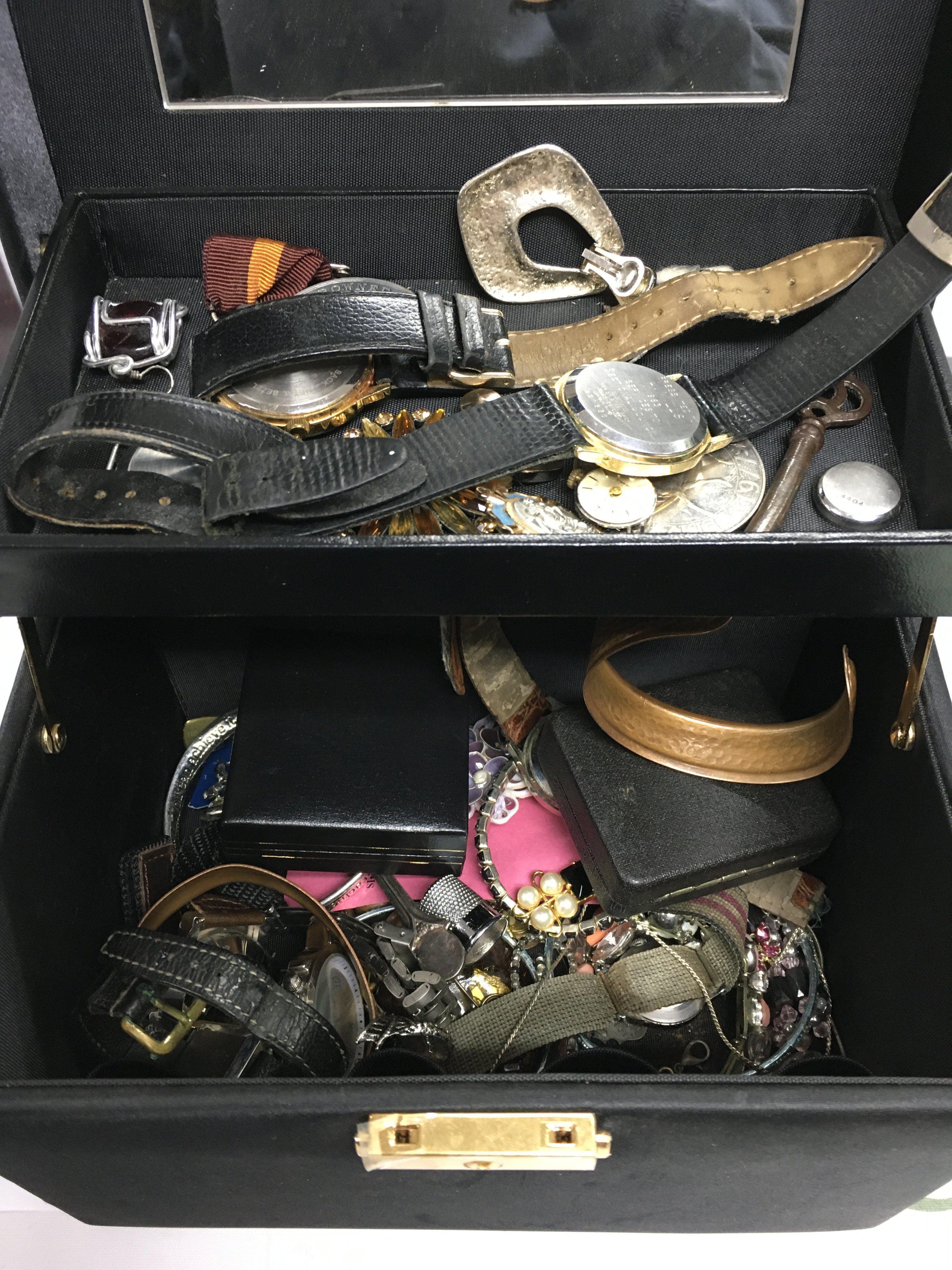 A box of costume jewellery and watches.