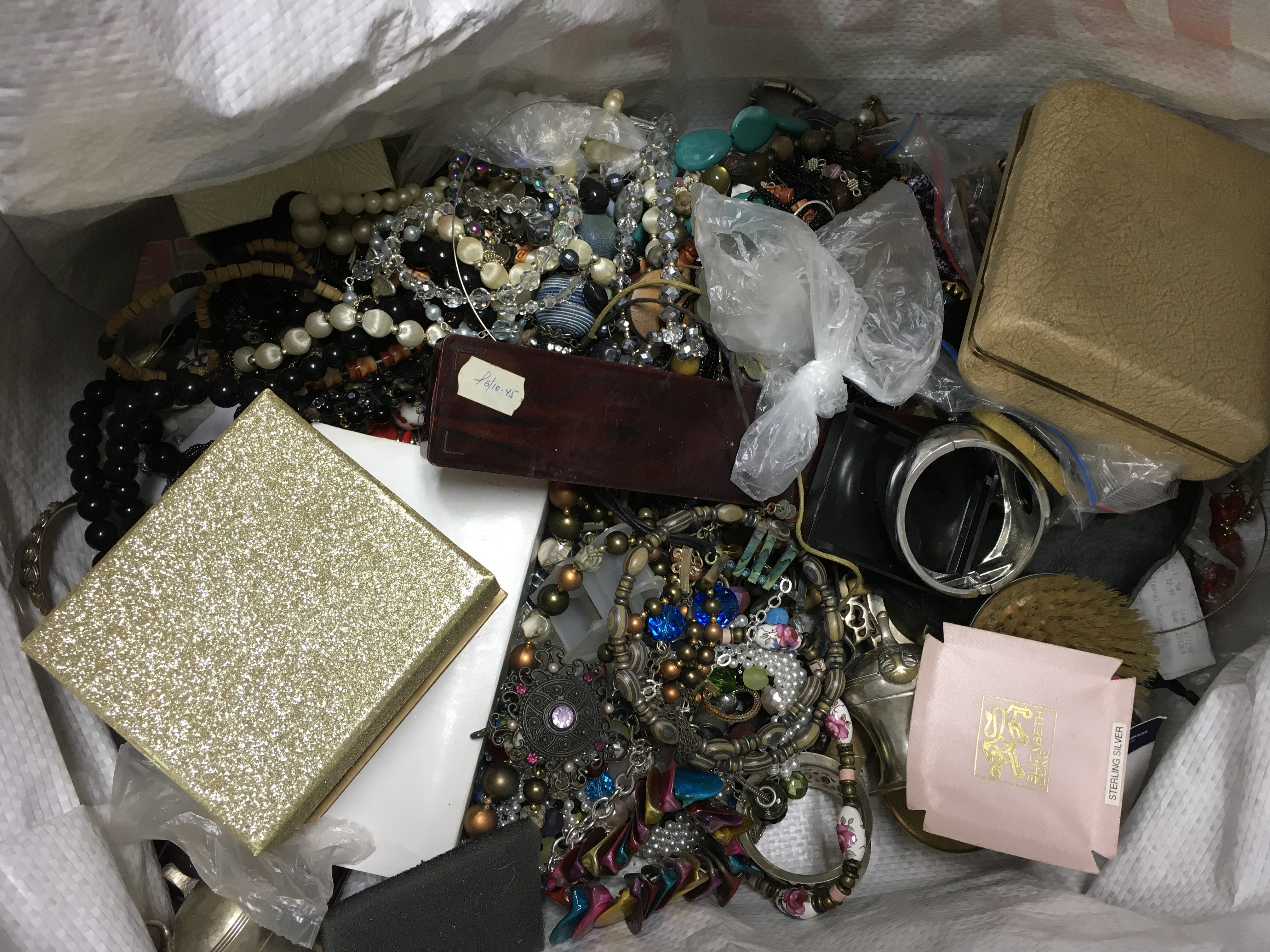 A large bag of costume jewellery, including other various items.